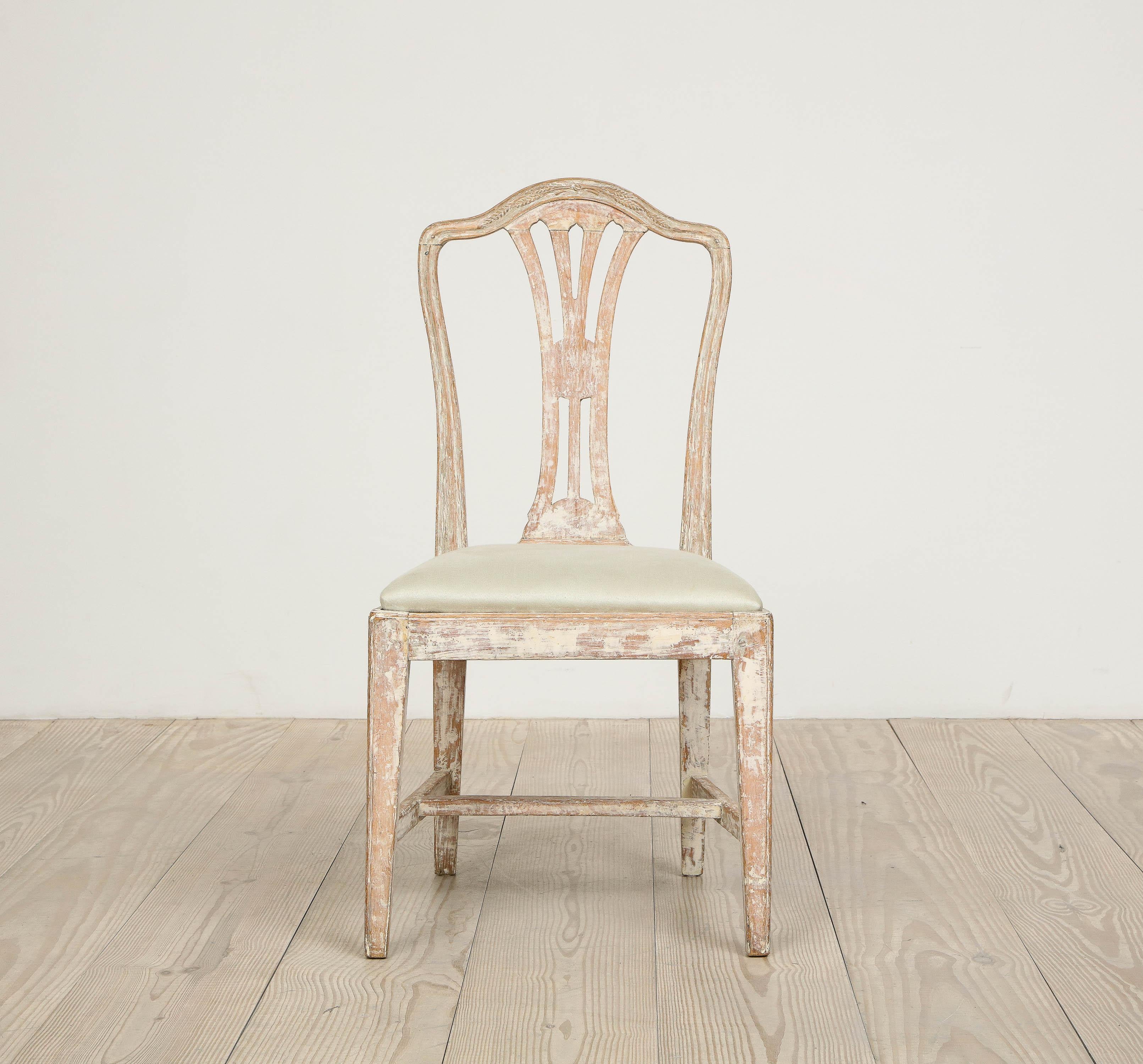 A fine Swedish Gustavian chair with beautiful wheat carvings, circa 1780, origin: Stockholm, Sweden, dry-scraped to the original color, reupholstered in Rogers & Goffigon fabric.
 
This chair is a wonderful example of Gustavian purity of design