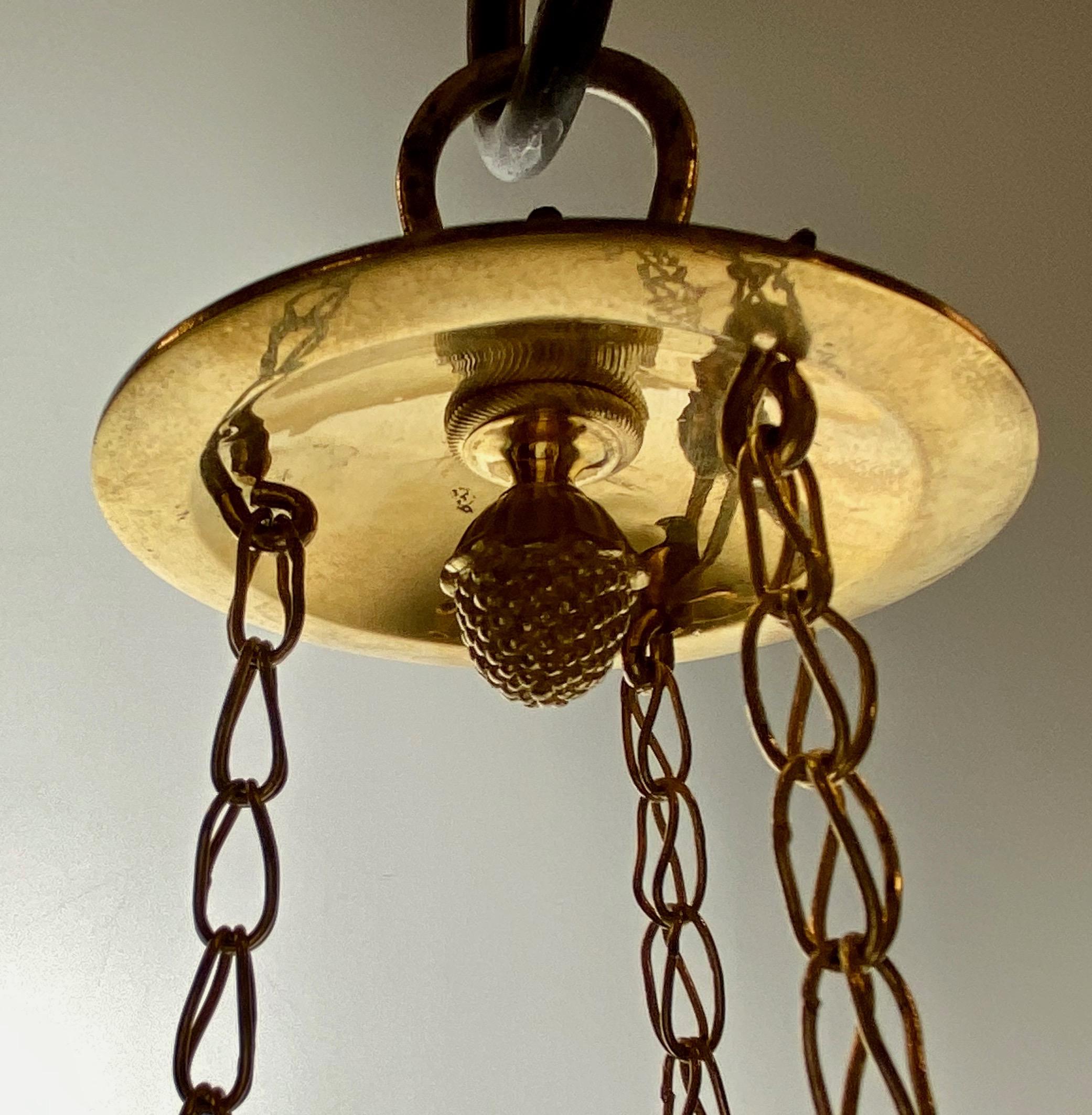 A rare Swedish Gustavian chandelier made for eight candles. This type is usually made of copper or bronceshetts shaped to the central bowl. This one is cast in bronze which was a much more expensive technique and results in a much higher level of