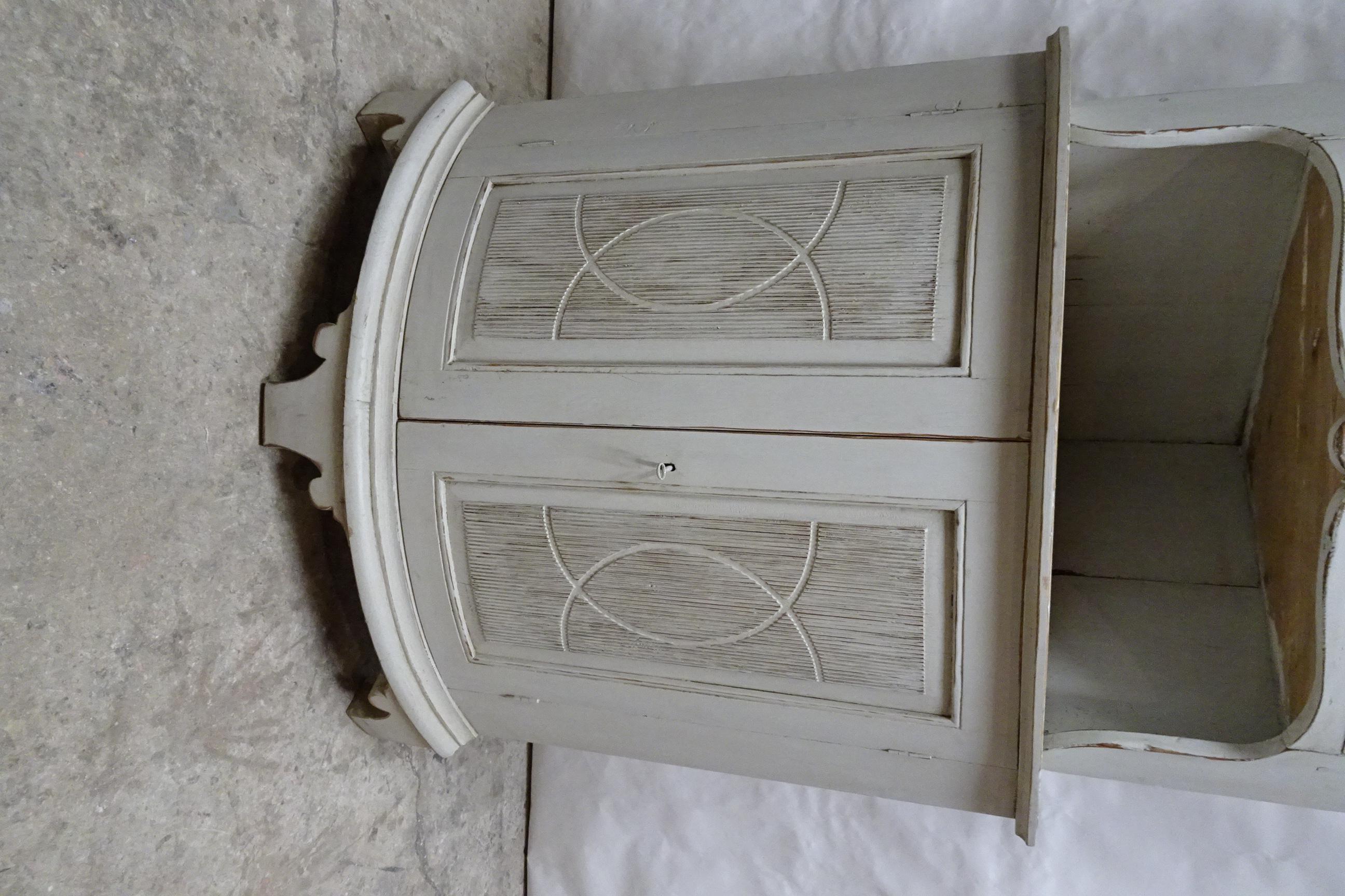 This is a Unique Swedish Gustavian Corner Cabinet. its been restored and repainted with Milk paints 