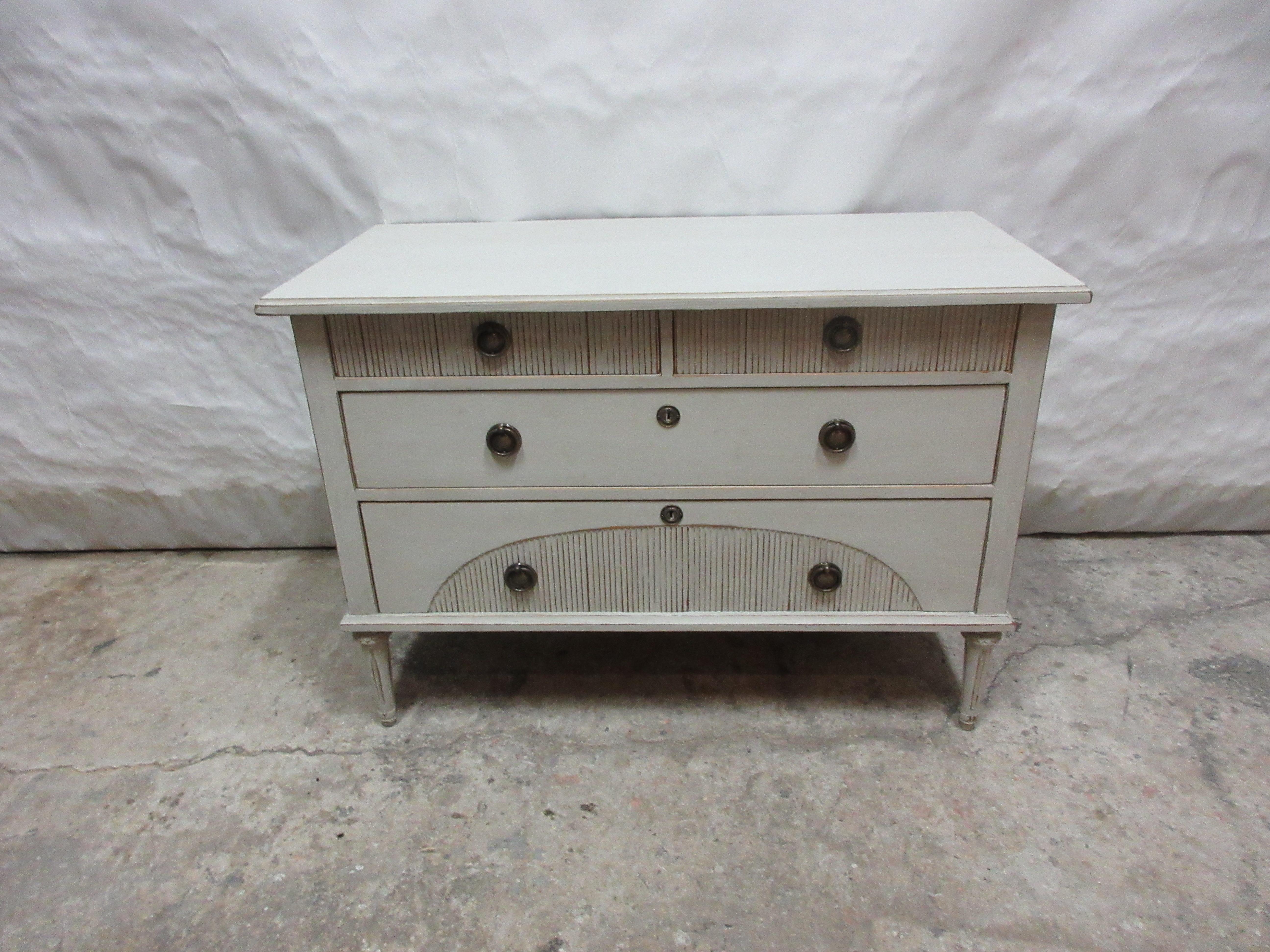This is a very Unique Swedish Gustavian Style 4 drawer chest of drawers. its been restored and repainted with Milk Paints 