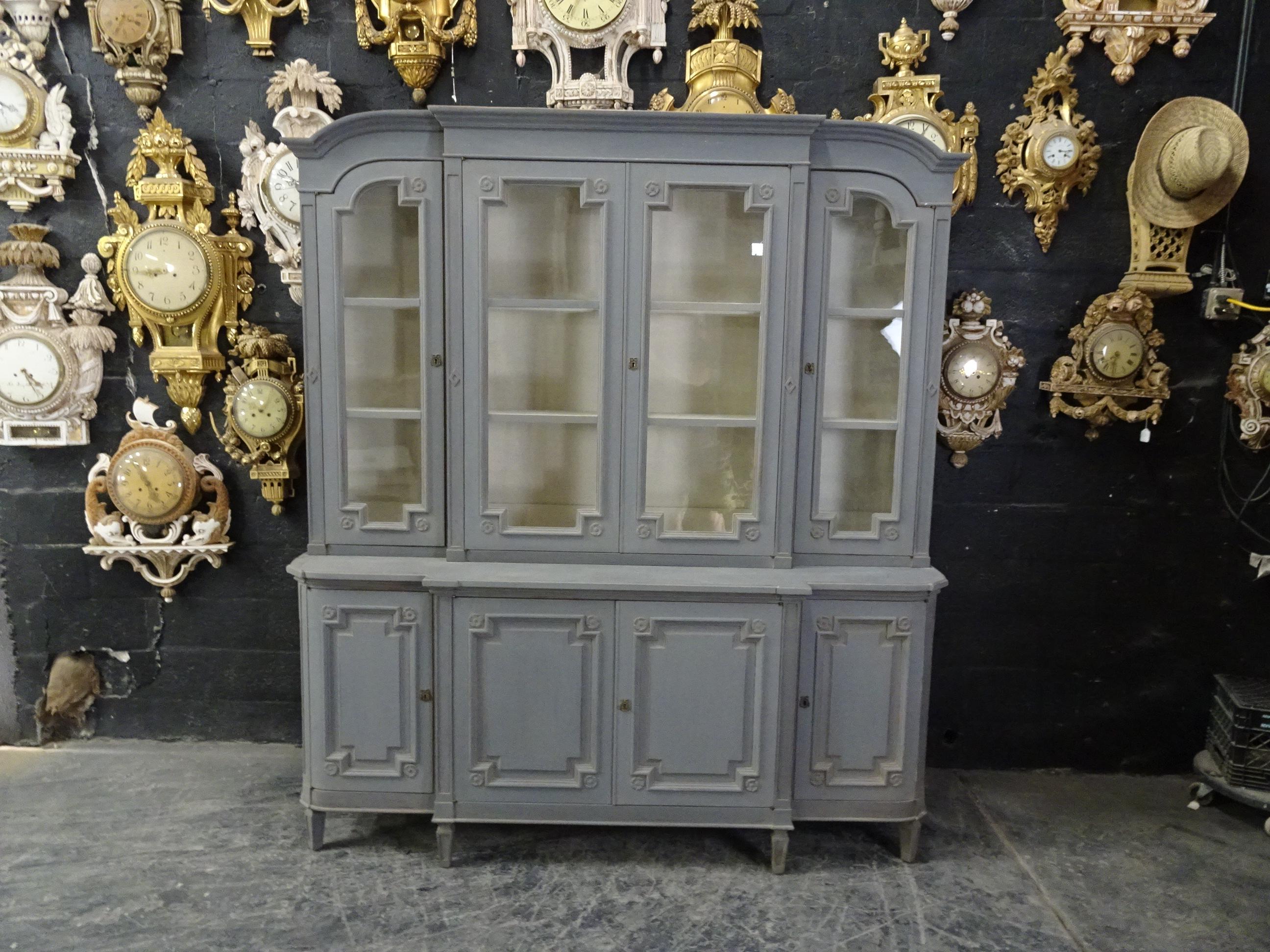 This is a Swedish Gustavian glass top Hutch. Its been restored and repainted with milk paint.
