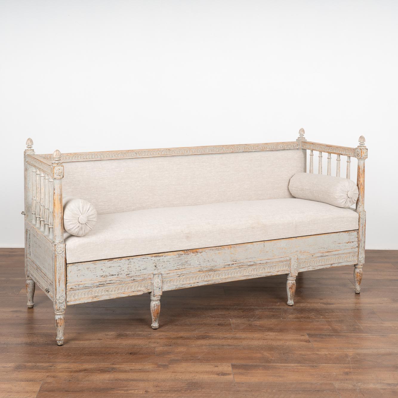This exceptional Swedish Gustavian sofa or settee has exquisitely carved details along back and skirt with spindle back and sides, all raised on six turned feet.
Please enlarge and examine the close up photos to appreciate the light gray (with hints