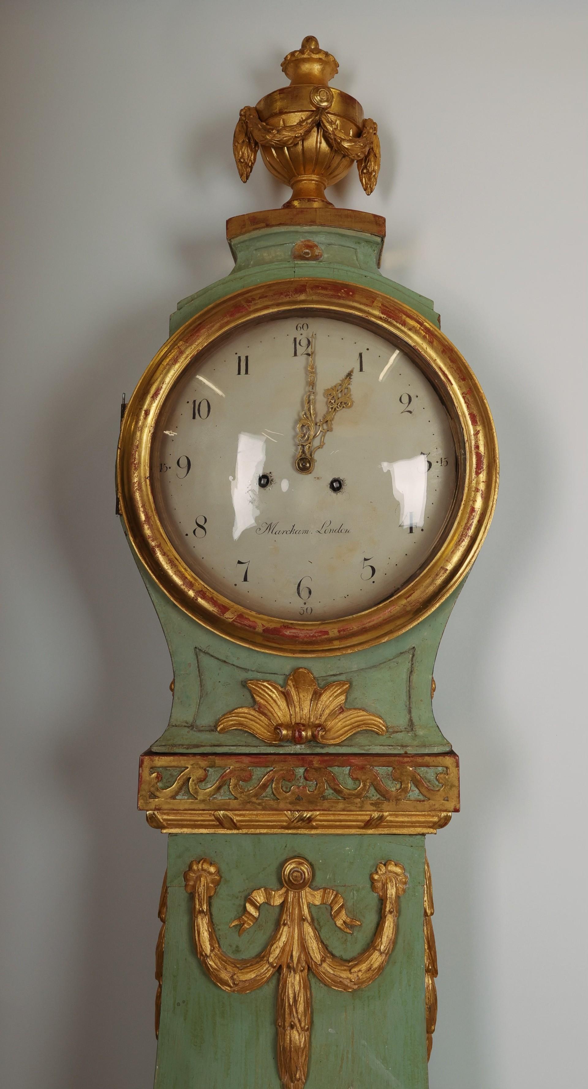 Fantastic Swedish Gustavian longcase clock. The case is a Stockholm work from around 1770/1780. It is lacquered and gilded with rich wood-carved details of, among other things, garlands, flowers, an urn and the 