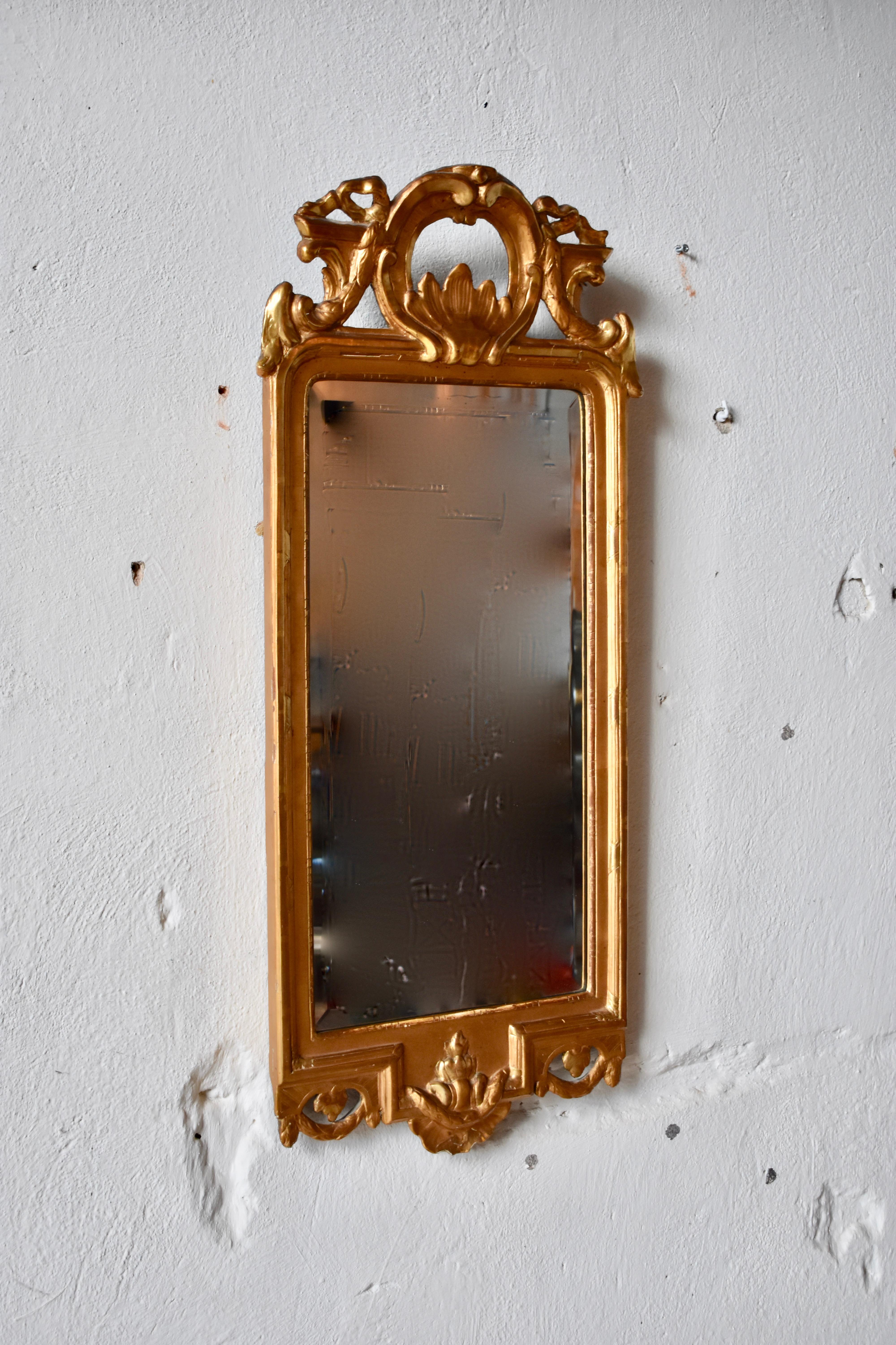 Swedish Gustavian mirror, made in Stockholm, IÅ,
Johan Åkerblad (1758-1799)

Excellent gilt work with amazing patina.
Marked with Stockholm hallstamp
Signed IÅ (See images)
Original glass.

 