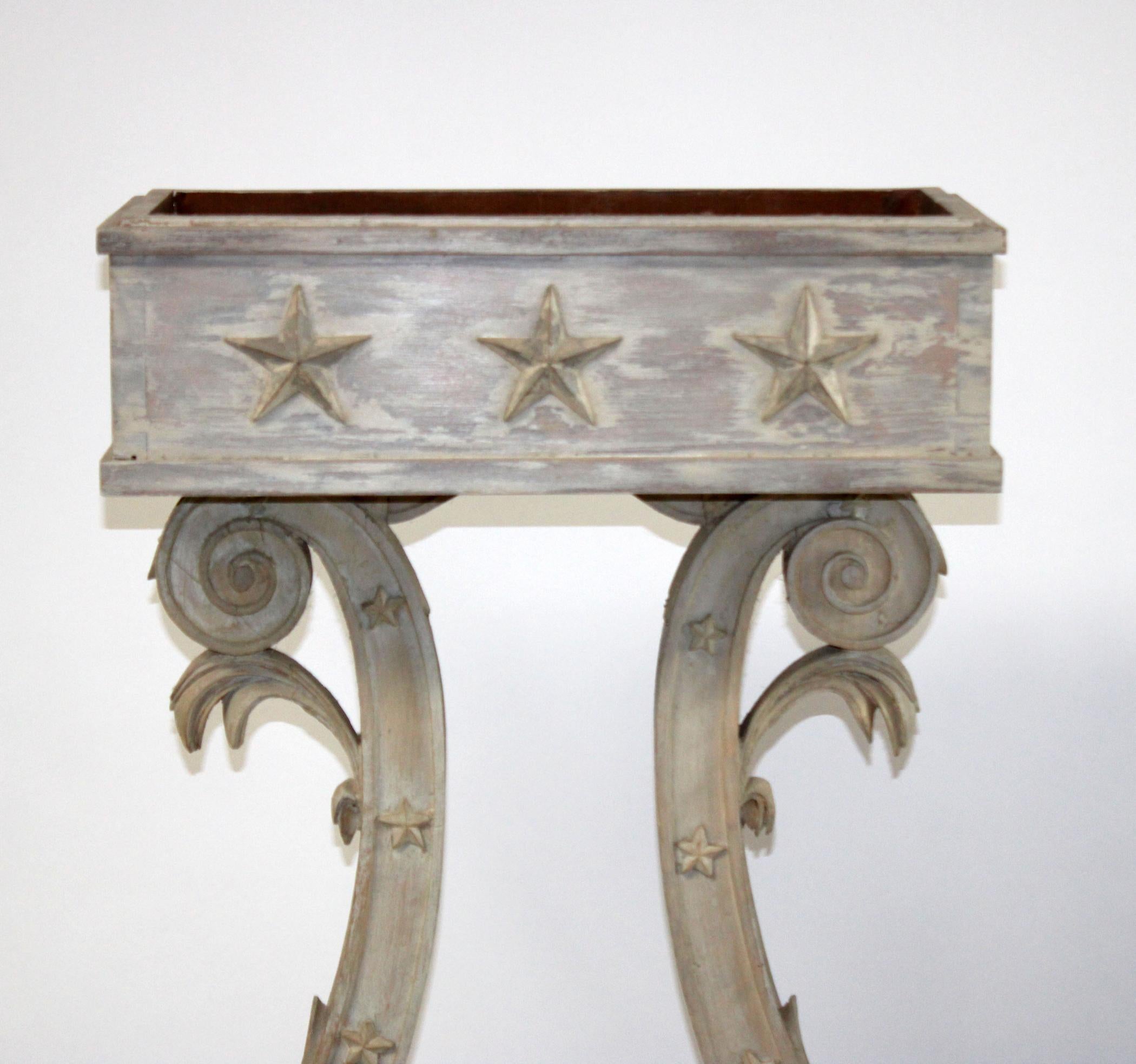 Gustavian style painted and distressed Lyre form planter. In the neoclassical taste. Wonderfully dovetailed and distressed. Quite charming.