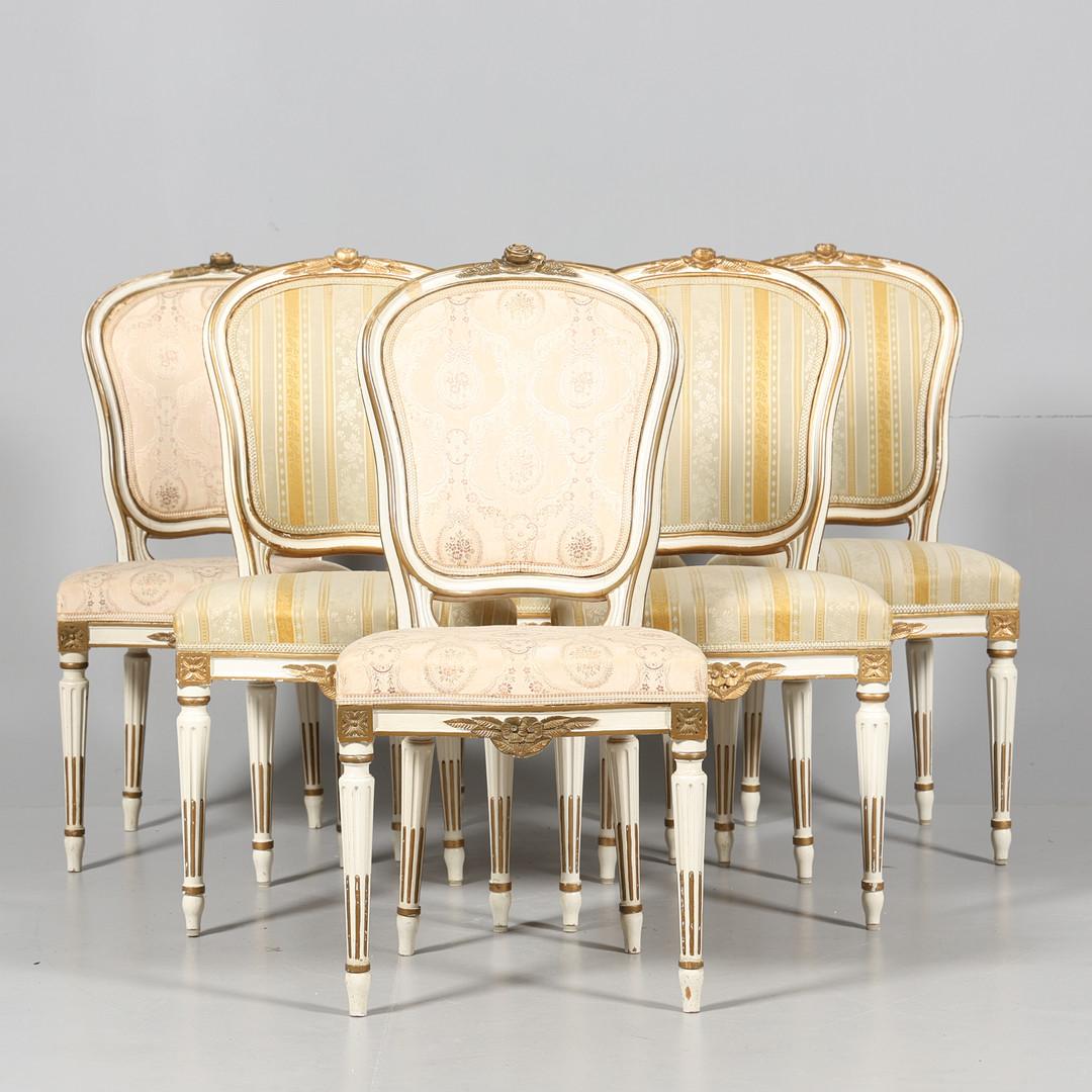 V Rare Set of 6 Swedish Gustavian padded back dining chairs in good condition in white paint with lovely detailed carvings , fluted legs and gilt style embellishment

Great for careful every day usage with comfy seats in the original fabric that is