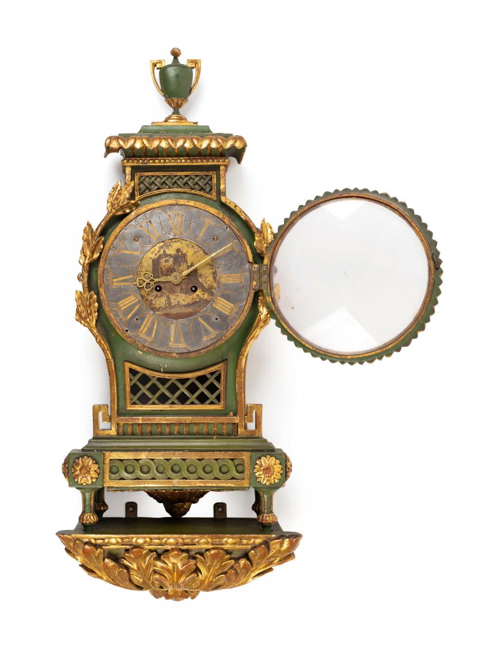 A Swedish neoclassical painted bracket clock and bracket
The clock early 19th century
Measures: Height of clock 28 x width 13 1/2 x depth 6 1/2 inches; height of bracket 7 1/2 x length 15 x depth 6 1/2 inches.
Provenance:
George Gravert
