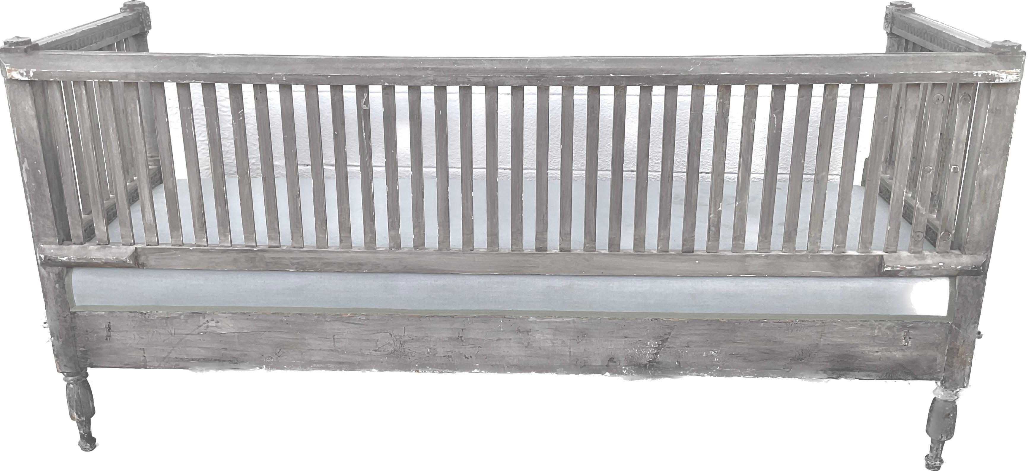 Early 19th century antique Gustavian daybed or sofa, made in Sweden, circa 1810. Painted a natural grayish blue worn with honest patina. The lovely patina enhances the carved details throughout the frame. Frame has beautiful hand carved