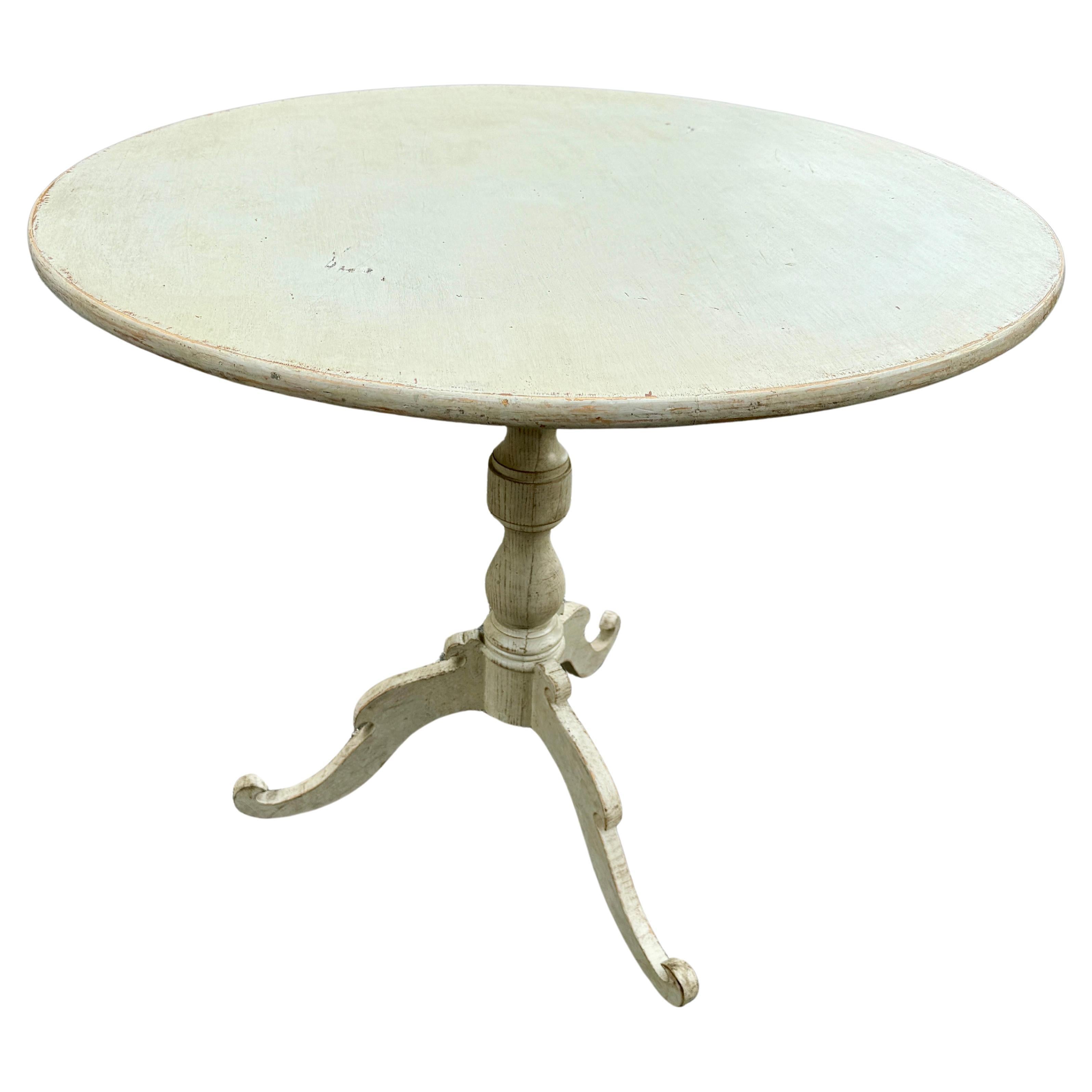 Painted Round Gustavian Center Hall Table

This classic Scandinavian style painted table has been constructed from solid wood with a hand-applied distressed finish. The color on this piece is a warm neutral creamy color, leaning towards a light