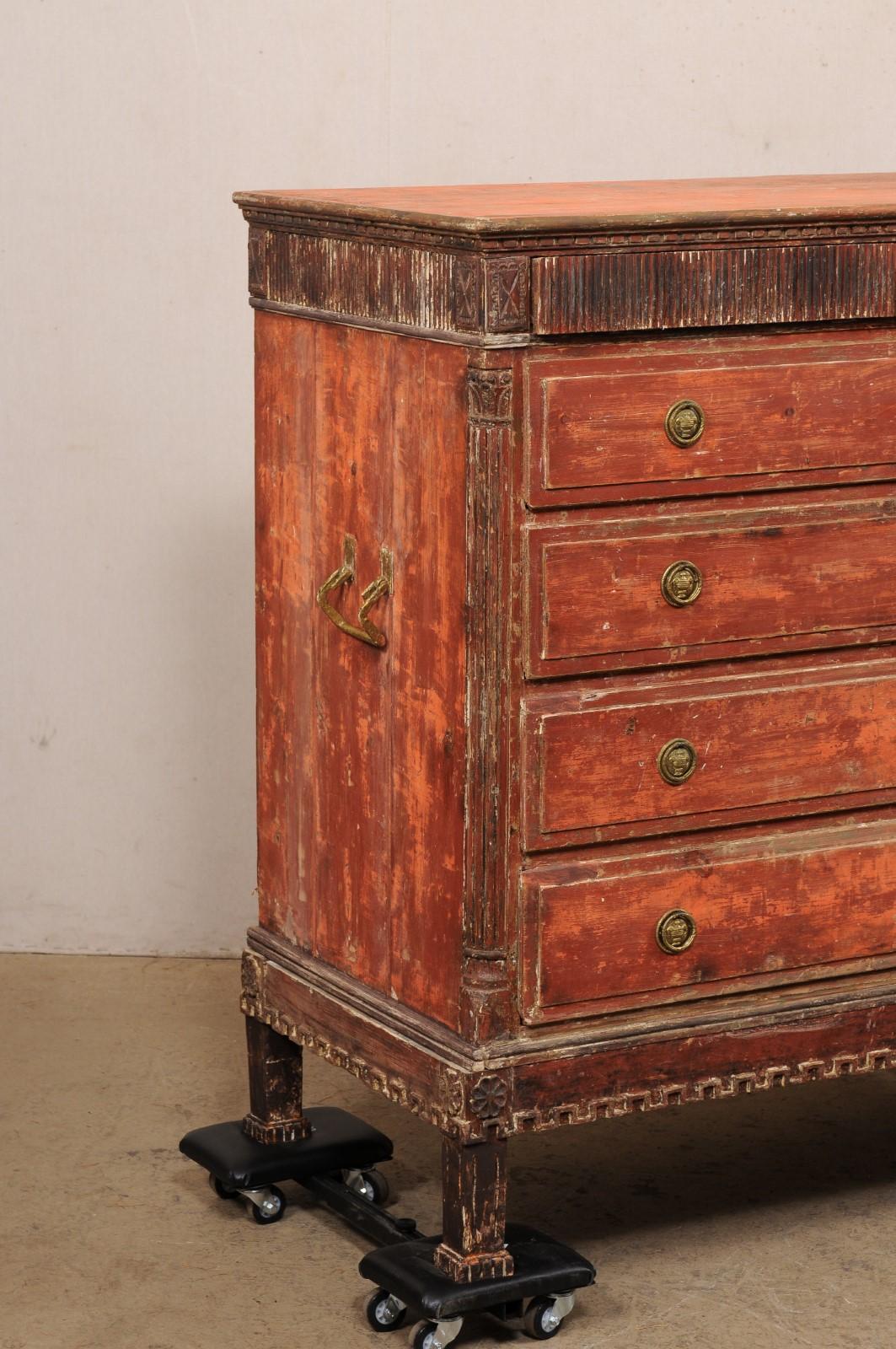 A Swedish Gustavian period chest, scraped to the original colors, from the turn of the 18th and 19th century. This antique chest from Sweden features clean lines outlined in magnificent carved details. The rectangular shaped top has dentil carved