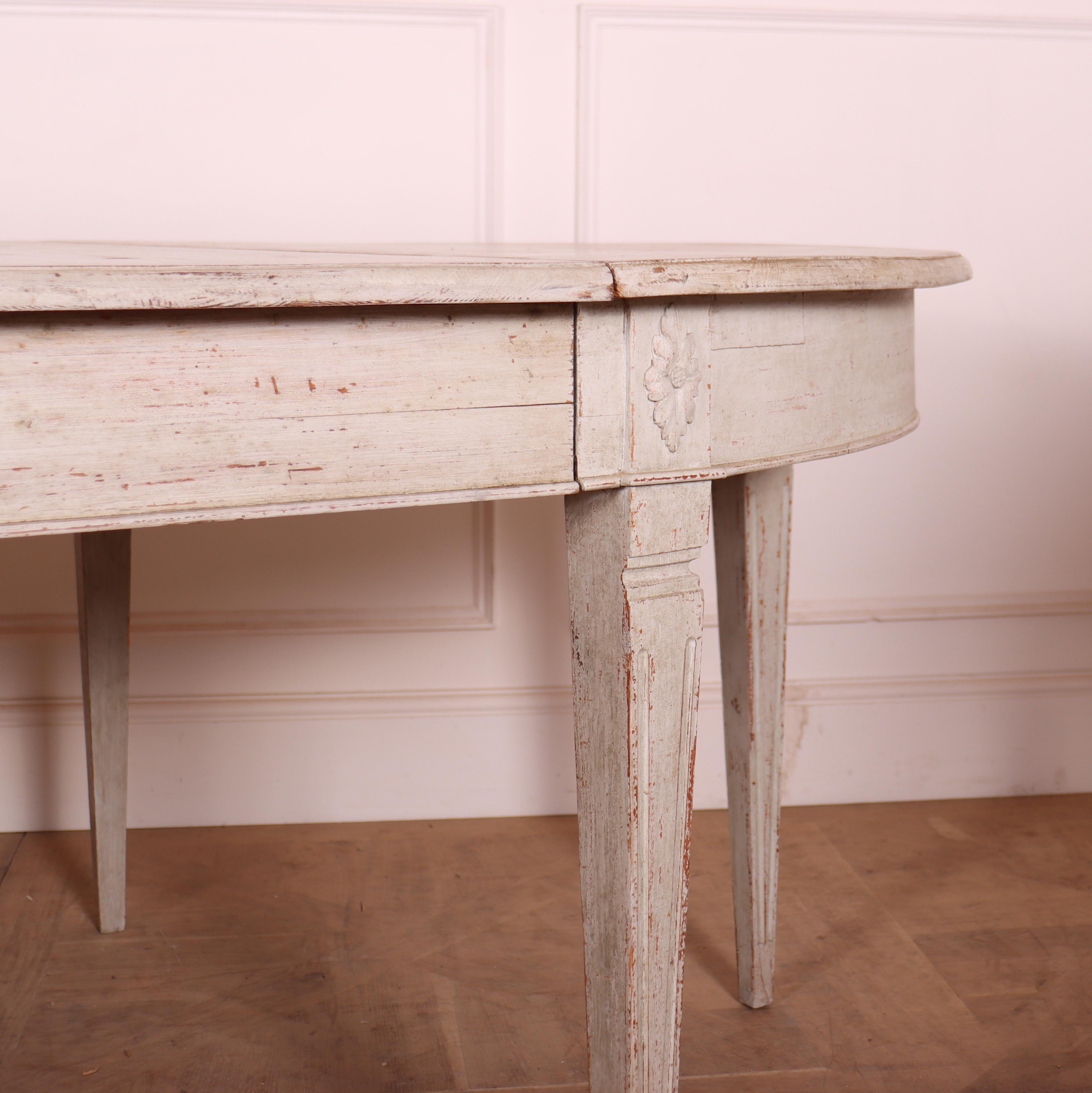 Early 19th century Swedish Gustavian period painted pine extendable dining table comprised of two demi-lunes and two leaves. 1810.



62cm clearance.

Reference: 7791

Dimensions
94 inches (239 cms) Wide
47 inches (119 cms) Deep
29.5