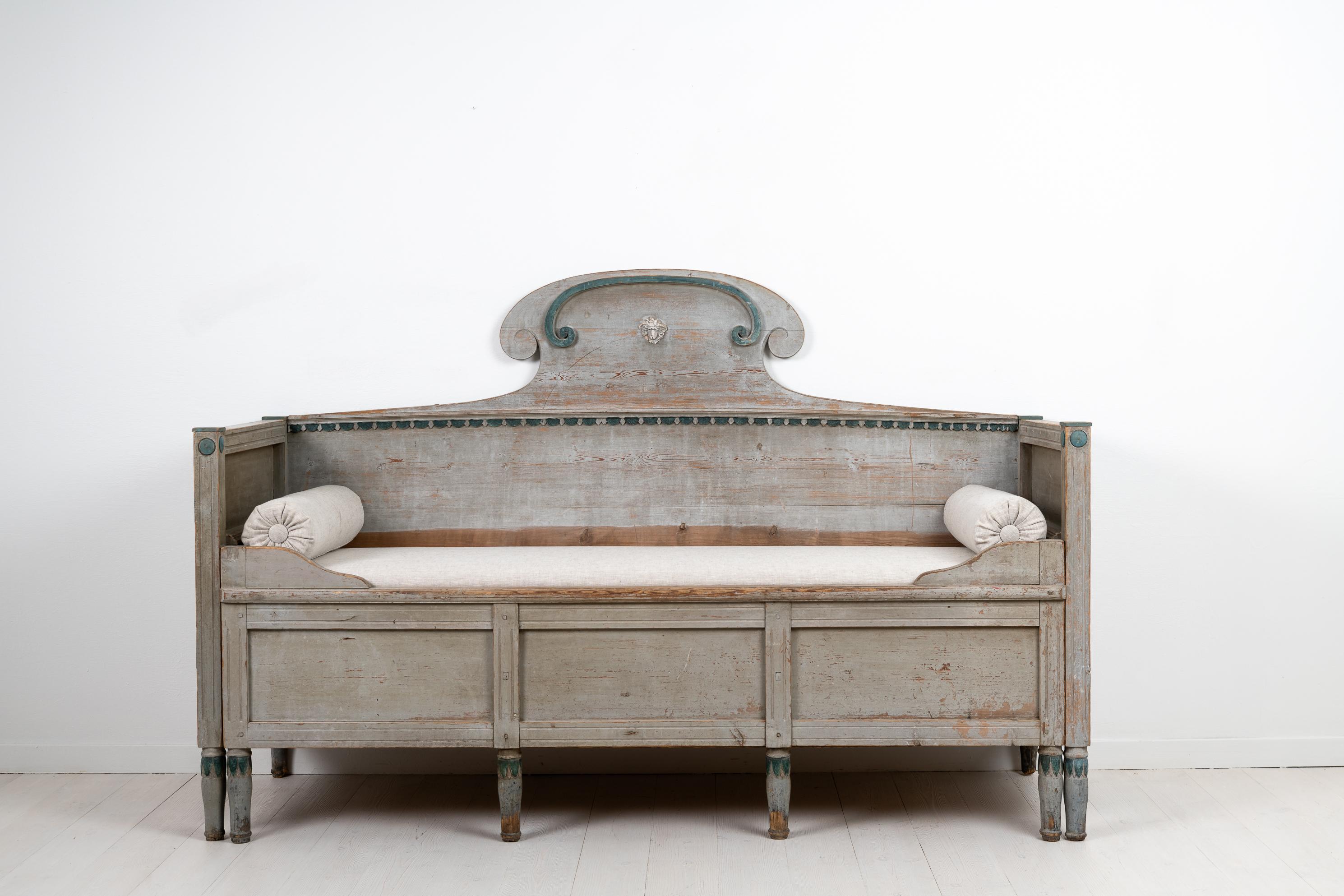 Gustavian Provincial sofa from the Swedish area Forsa in Hälsingland. The sofa is from the early 1800s, around 1820, and has the original grey paint with green accents. After being in use for 200 years the sofa has the genuine distress and patina of