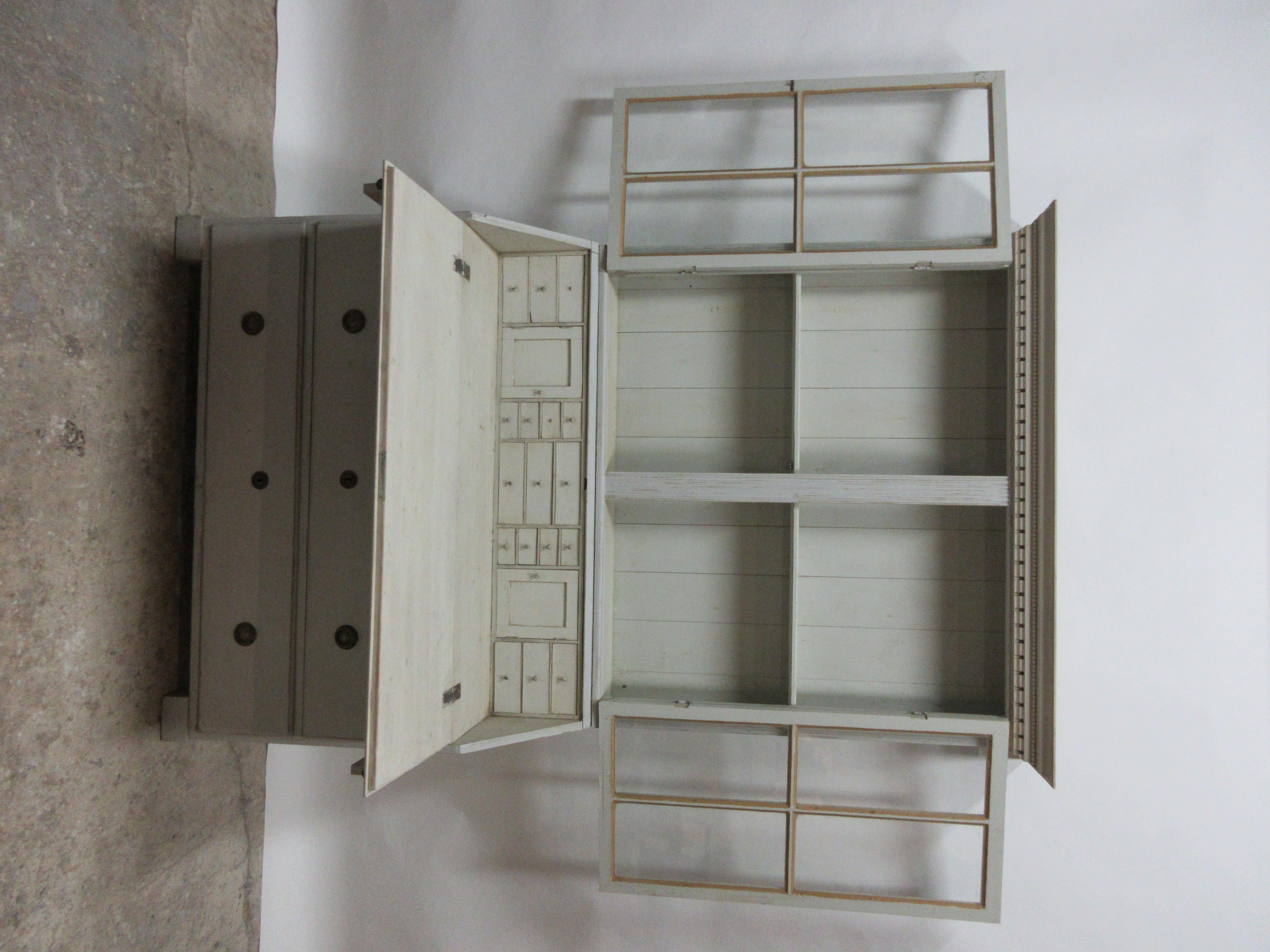 This is a Swedish Gustavian secretary hutch. Its been restored and repainted with milk paint.