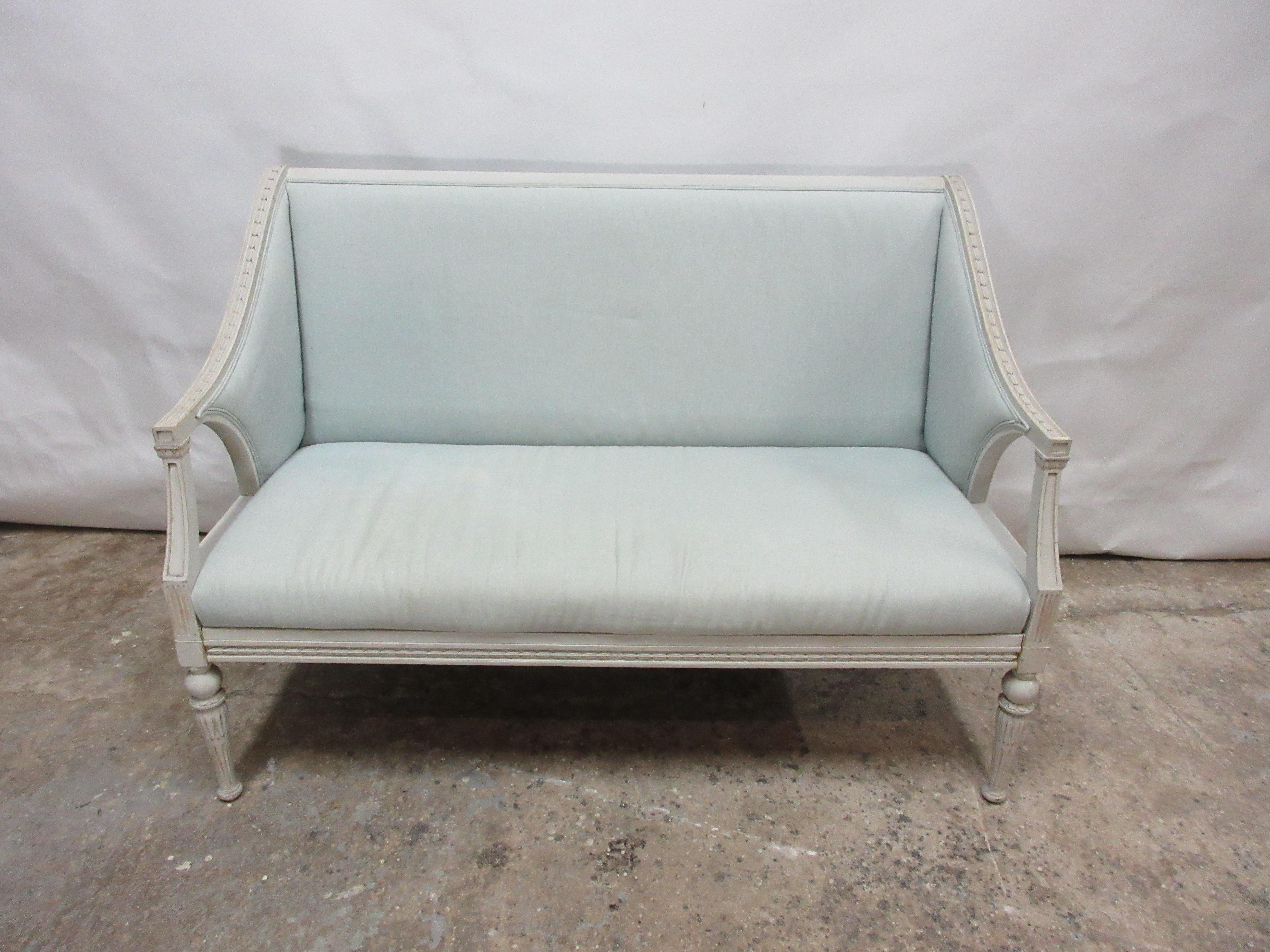 This is a Swedish Gustavian settee. When it was restored, it was repainted in milk paints 