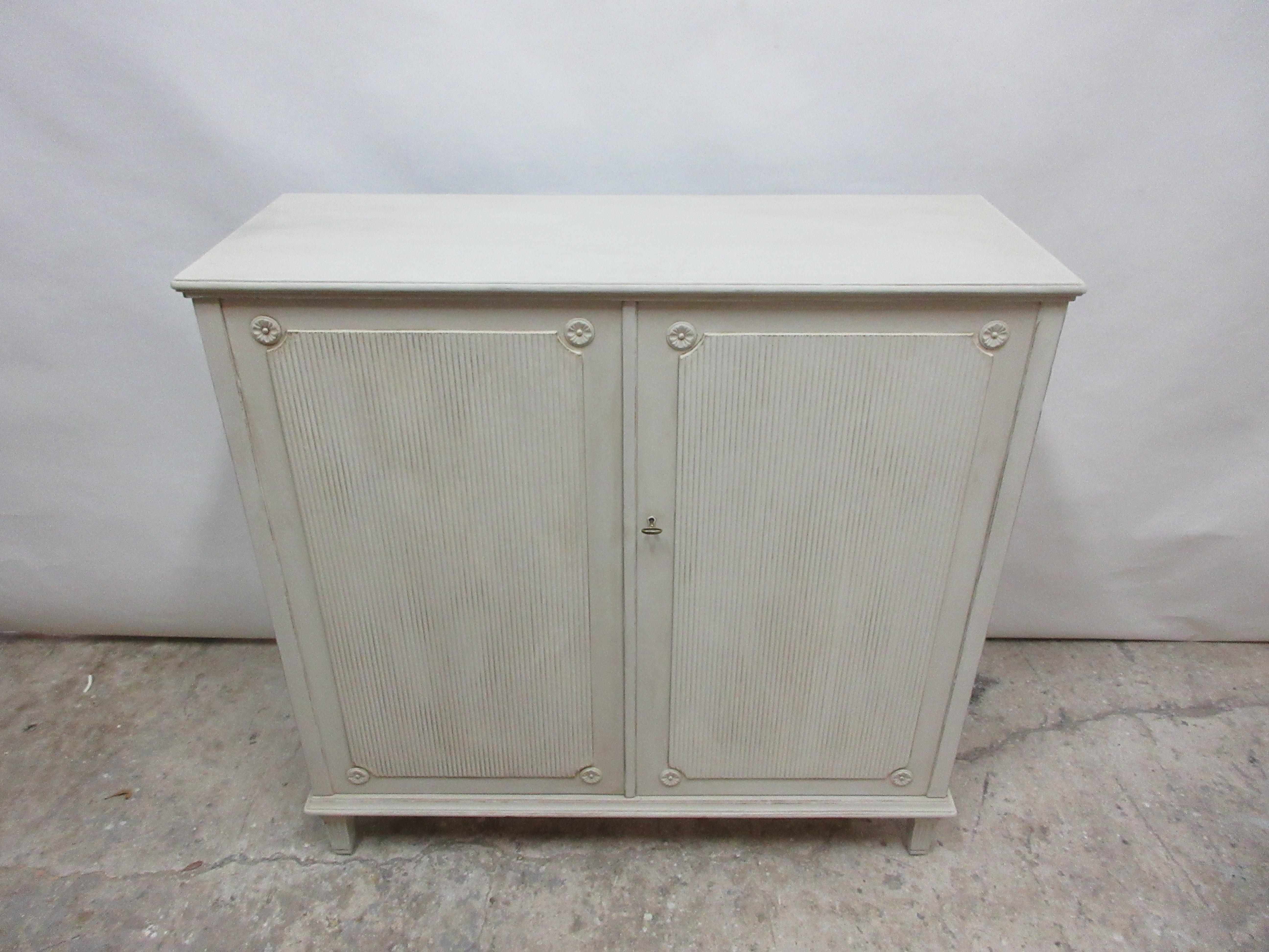 This is a Swedish Gustavian sideboard 2-door. It’s been restored and repainted with milk paints 