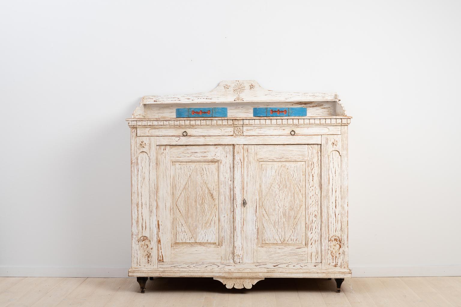 Swedish Gustavian sideboard from Sidensjö, Ångermanland. Old historic distressed paint from the early 1900s. The sideboard was manufactured during the late 1700s. The key and lock are original and functional.