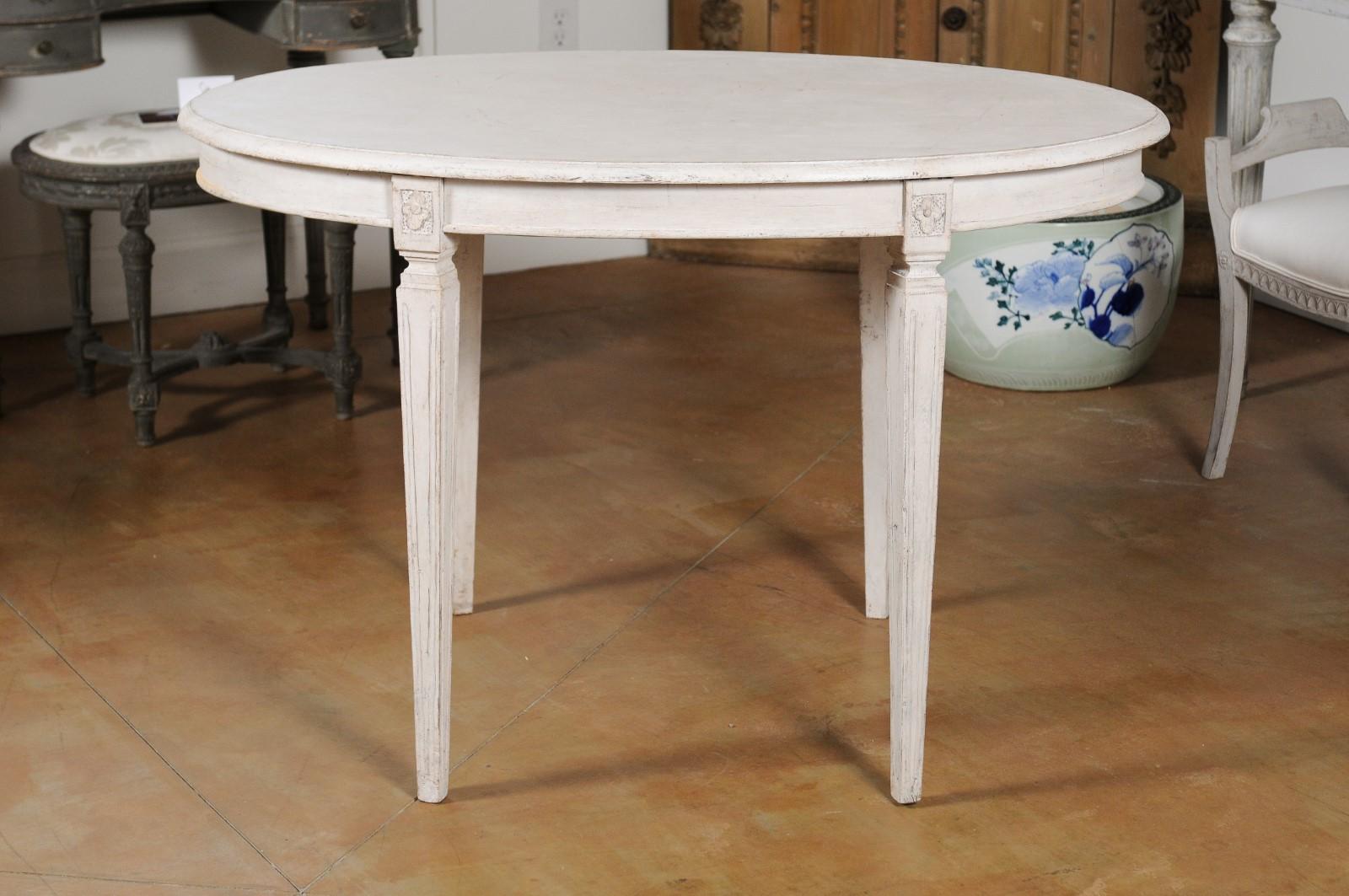 oval dining table fluted legs