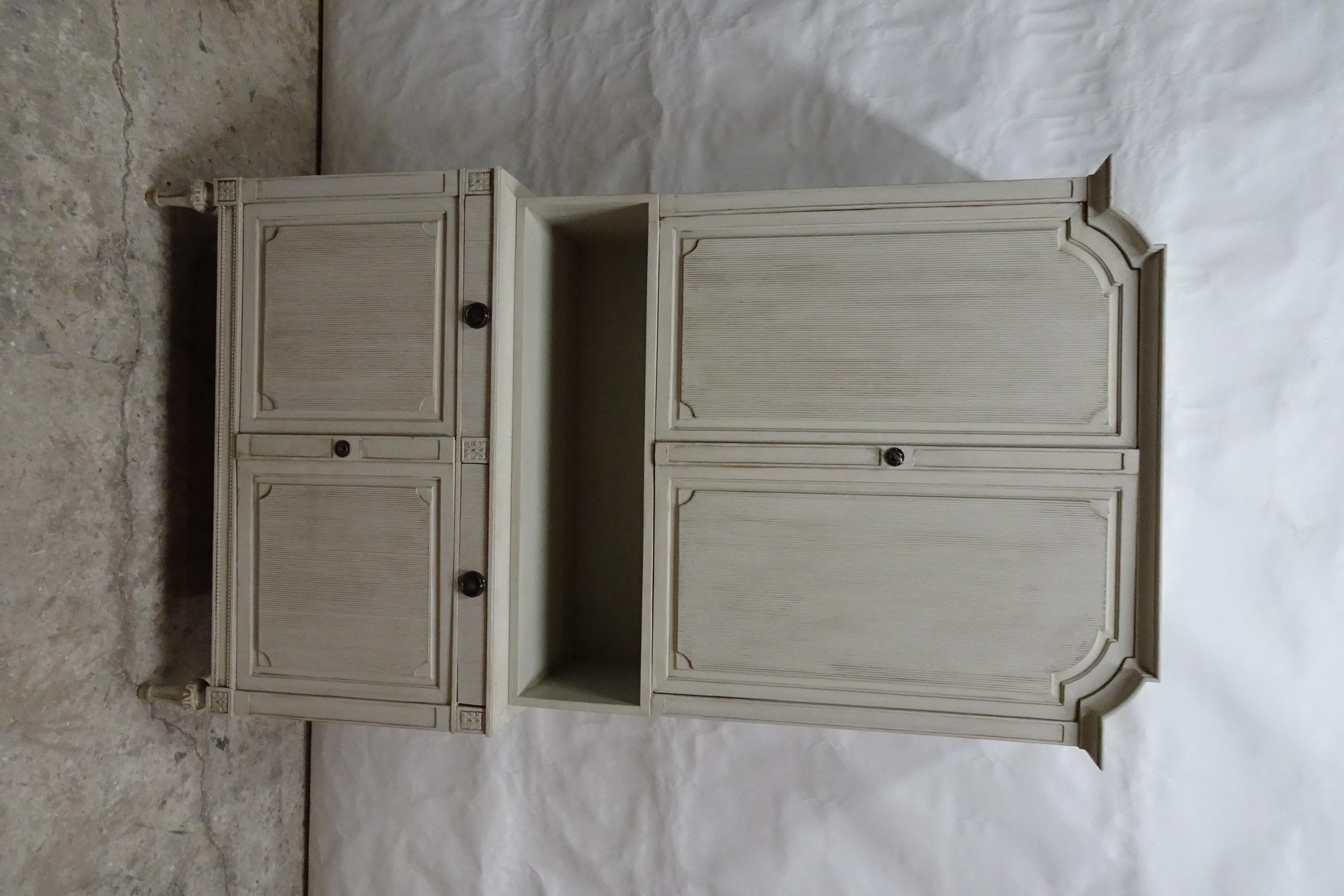 This is a unique Swedish Gustavian Style 4 Door Cabinet. Its been restored and repainted with Milk Paints 
