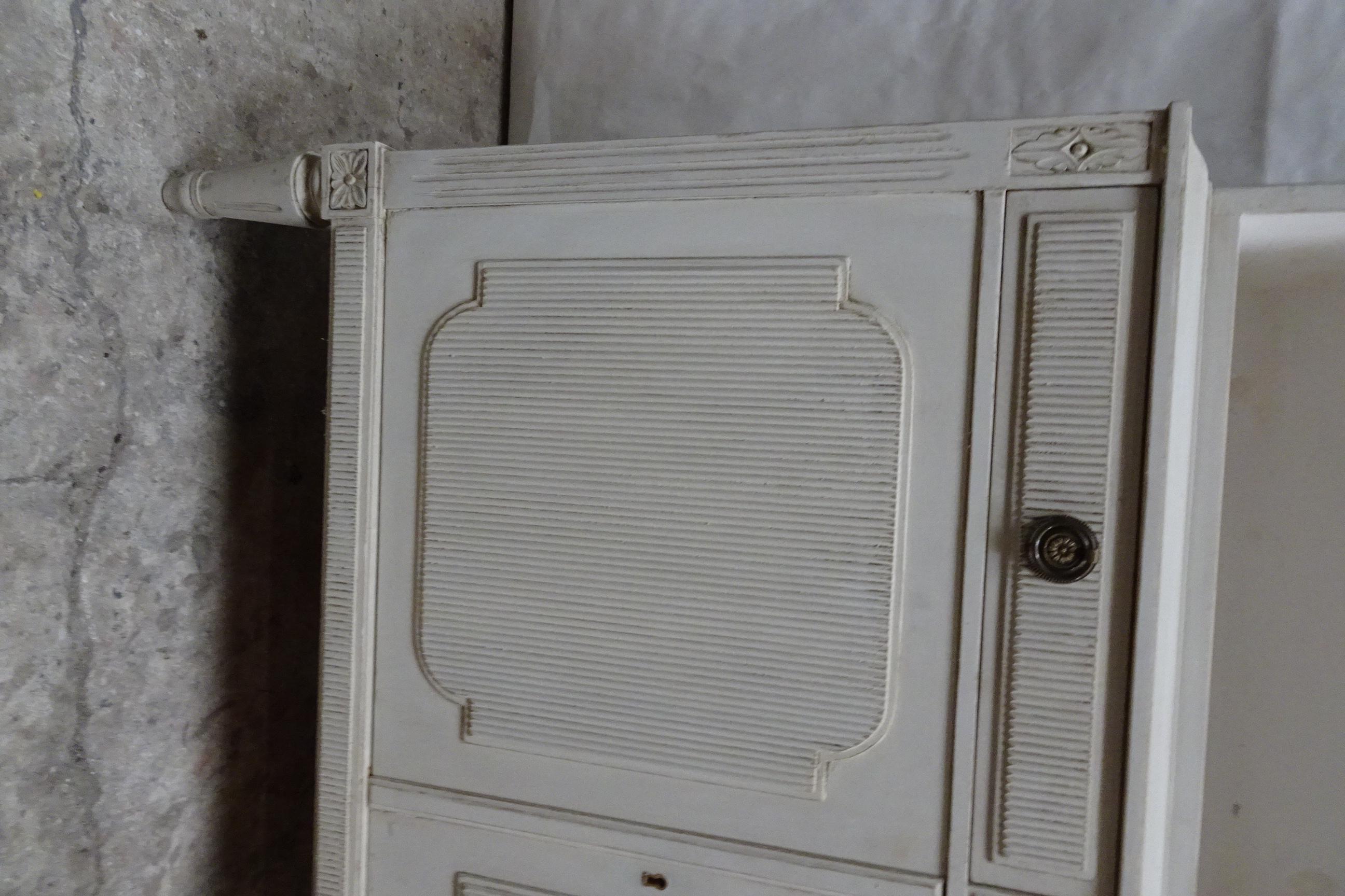 This is a unique Swedish Gustavian style 4 door cabinet. its been restored and repainted with Milk Paints 