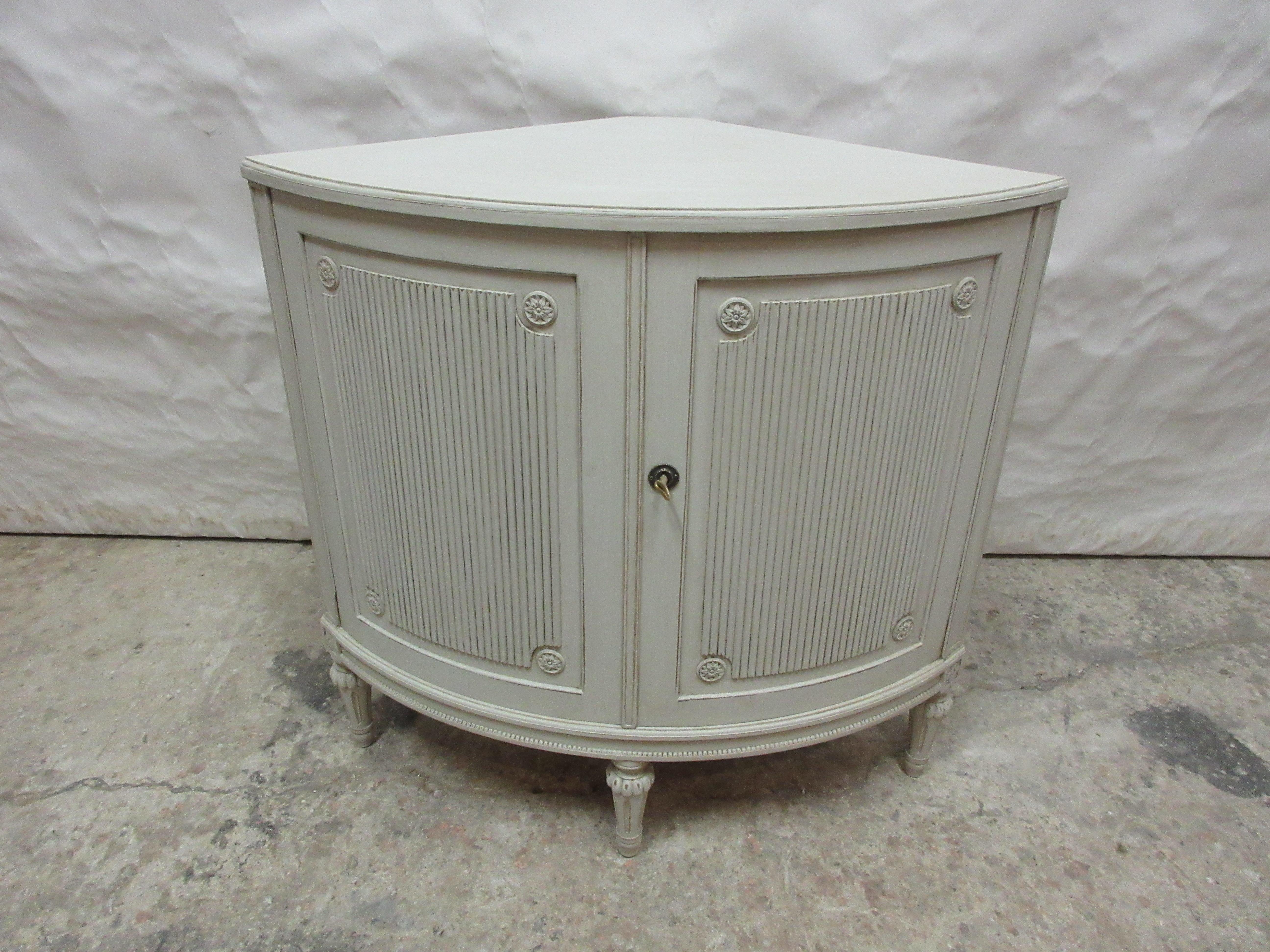 This is a very Rare and unique Swedish Gustavian Style Corner Cabinet . there mainly used as corner bars.    its been restored and repainted in Milk Paints 