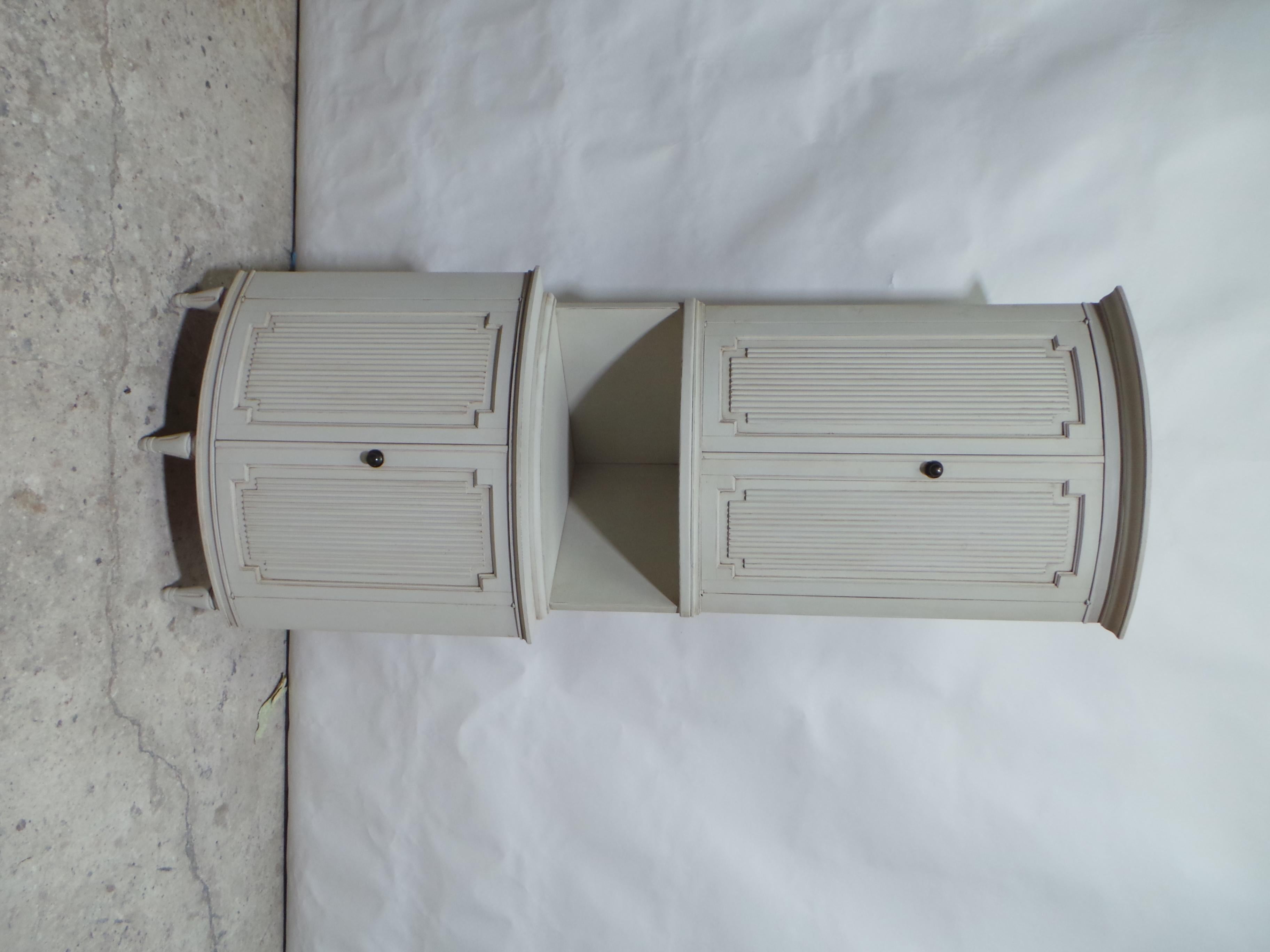 This is a unique Swedish Gustavian Style Corner Cabinet. its been restored and repainted with Oyster White.   somewhere in time the middle section was added maybe to raise the overall height of the piece.
   from the very back out to each corner its