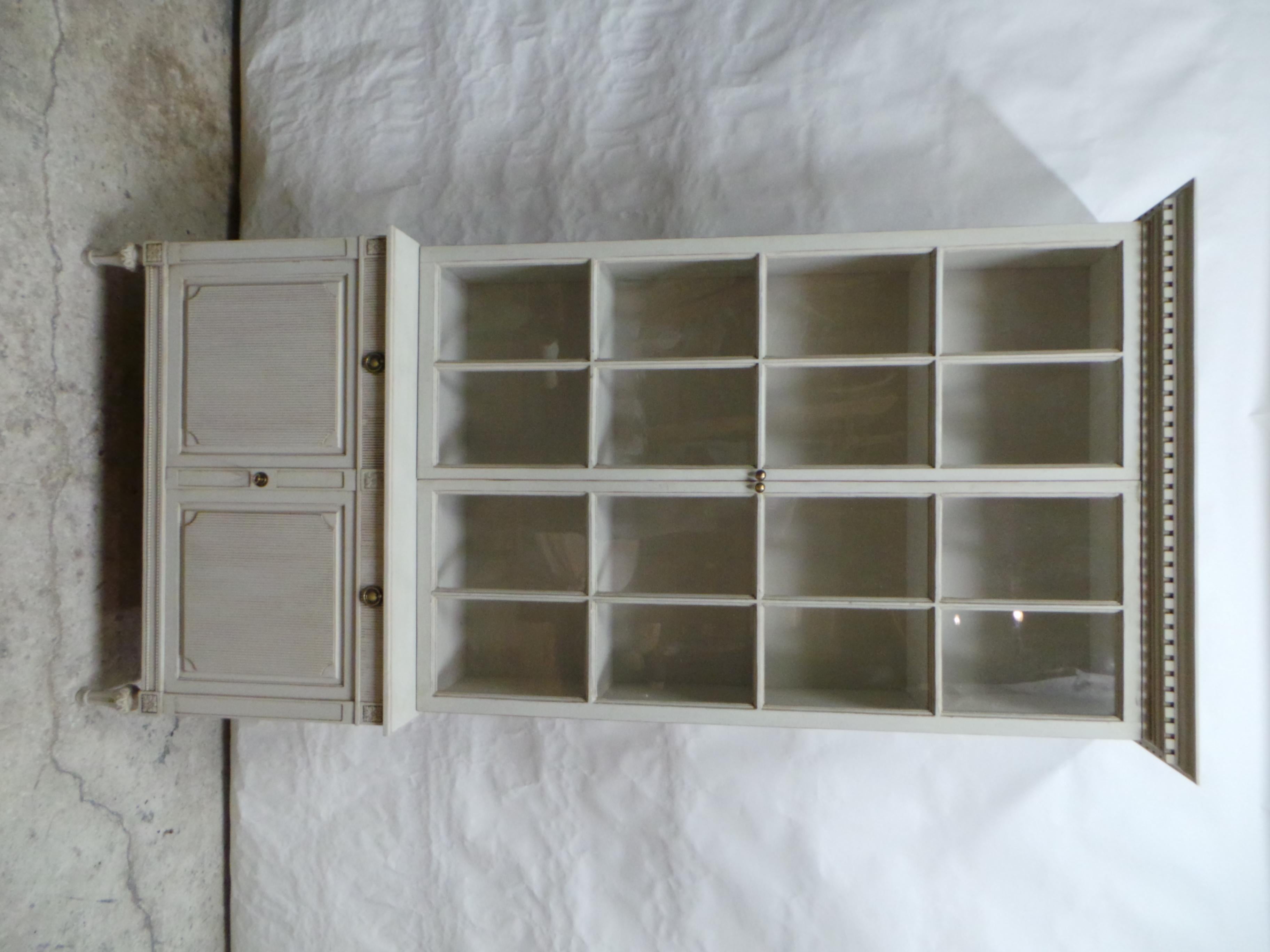 This is a Swedish Gustavian Style Glass Top Hutch. the bottom cabinet is circa 1950 the upper glass top is New made using Antique windows found at an Estate Auction in Sweden.  the glass in the windows are full of bubbles and wavy glass.  This