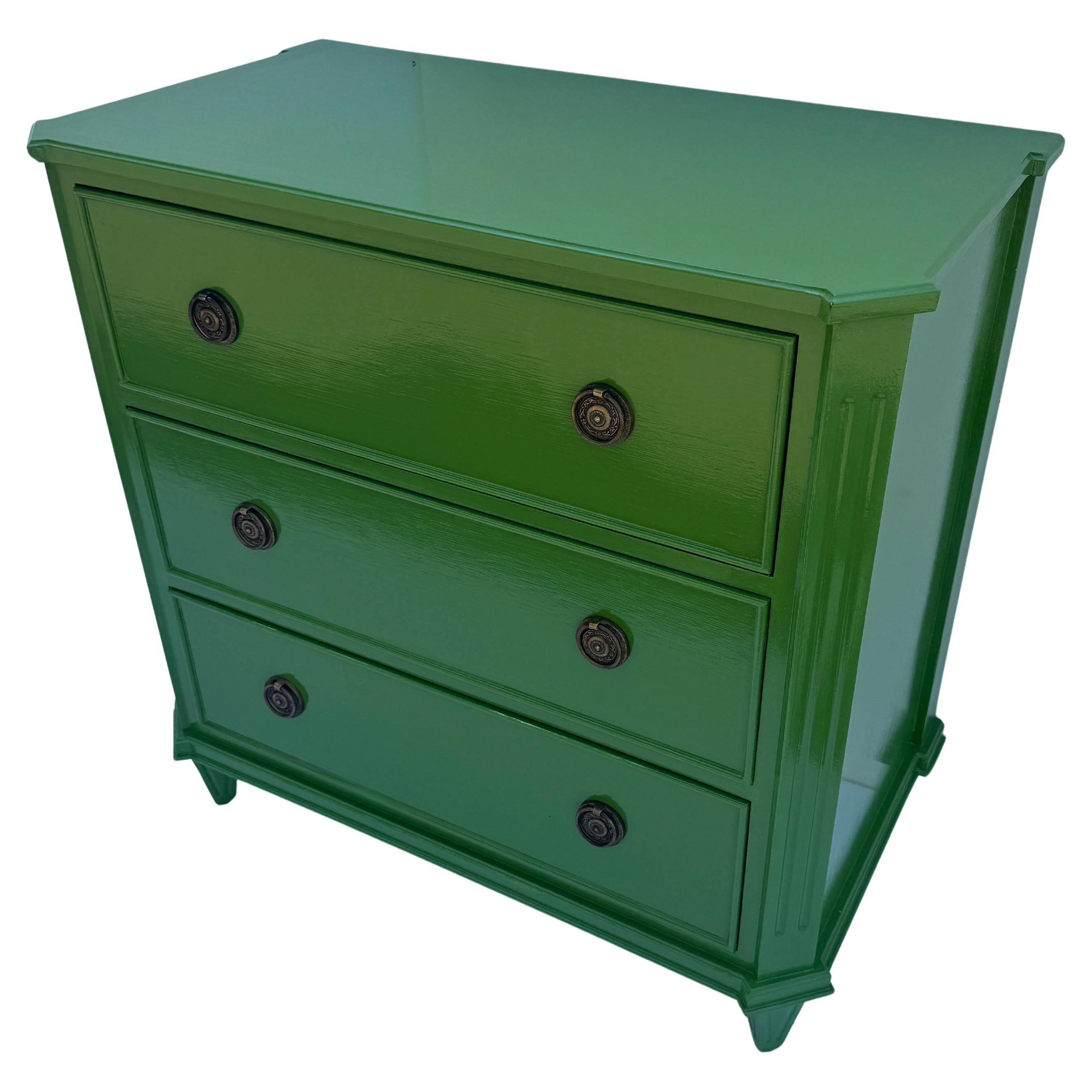 Green Lacquered Gustavian Style Chest of Drawers Bureau

This classic Swedish style three drawer lacquered chest has been constructed from solid wood with a hand-applied finish in what we have termed a glossy magnolia green leafy color. This piece