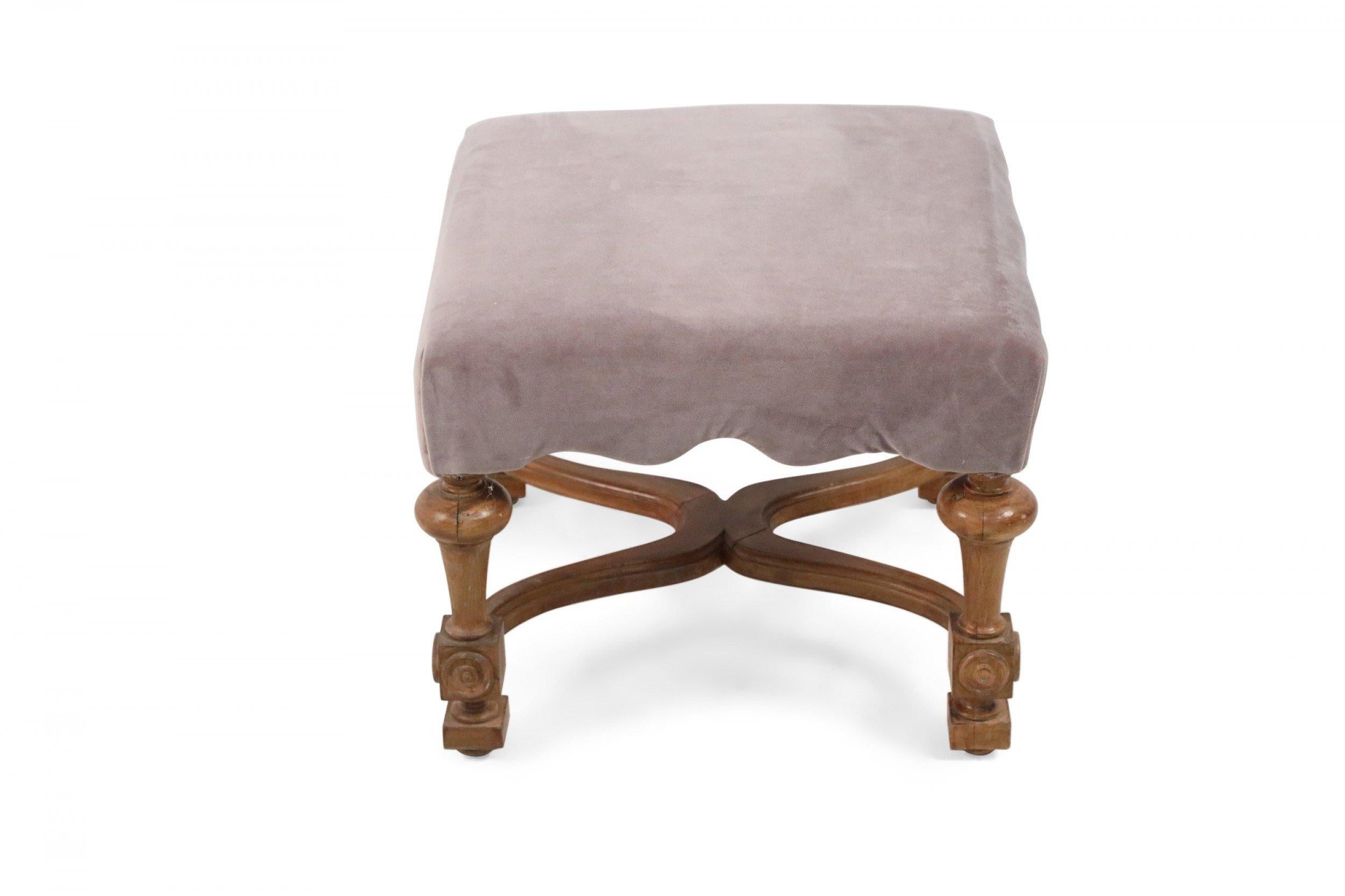 Swedish Gustavian-style footstool combining a scalloped top upholstered in mauve velvet with a curved oak x-stretcher carved with decorative medallions.
   