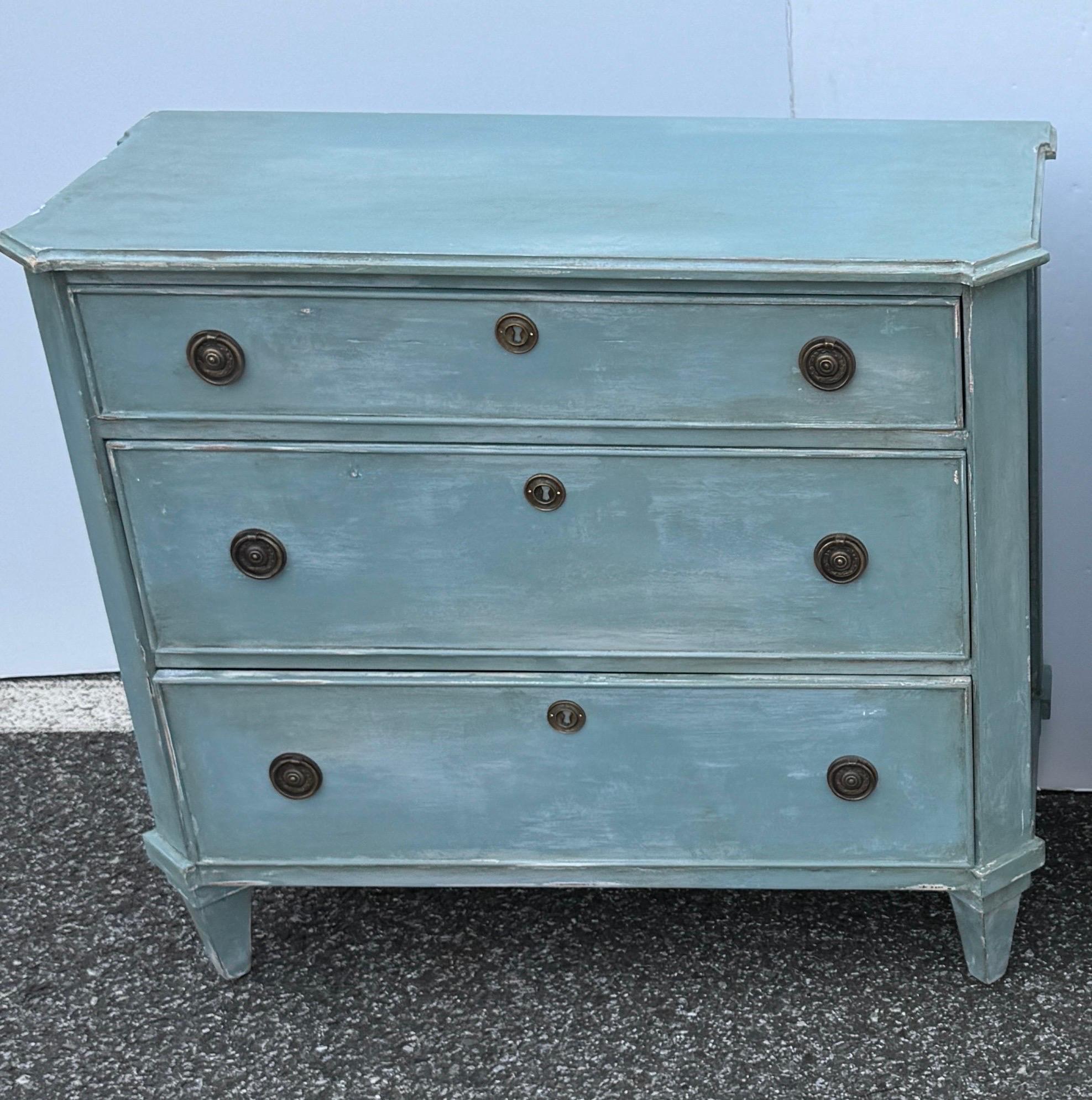 Blue Painted Swedish Gustavian Style 3 Drawer Chest Bureau.

This three drawer bureau is based on an 18th Century Gustavian antique chest. The chest is handmade and hand painted with solid wood legs and frame. The detailing is impeccable and