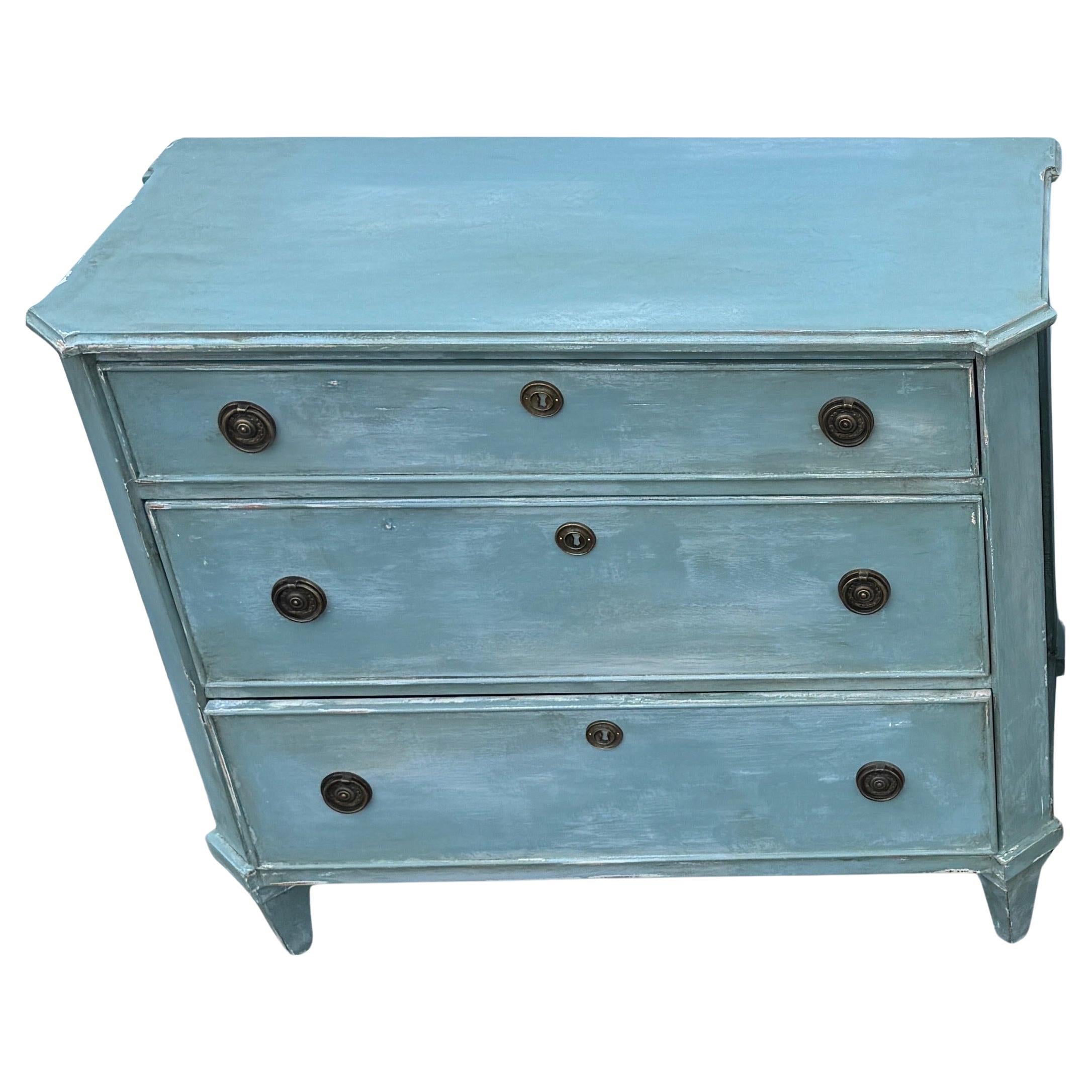 Blue Painted Swedish Gustavian Style 3 Drawer Chest Bureau.

This three drawer bureau is based on an 18th Century Gustavian antique chest. The chest is handmade and hand painted with solid wood legs and frame. The detailing is impeccable and