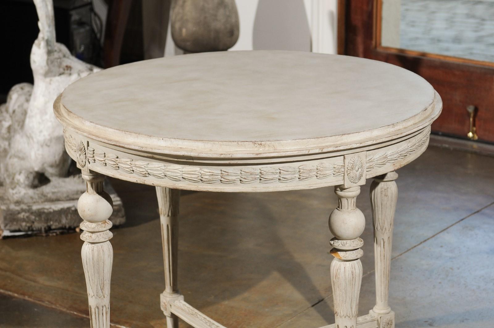 19th Century Swedish Gustavian Style Painted Wood Round Table with Carved Apron and Legs