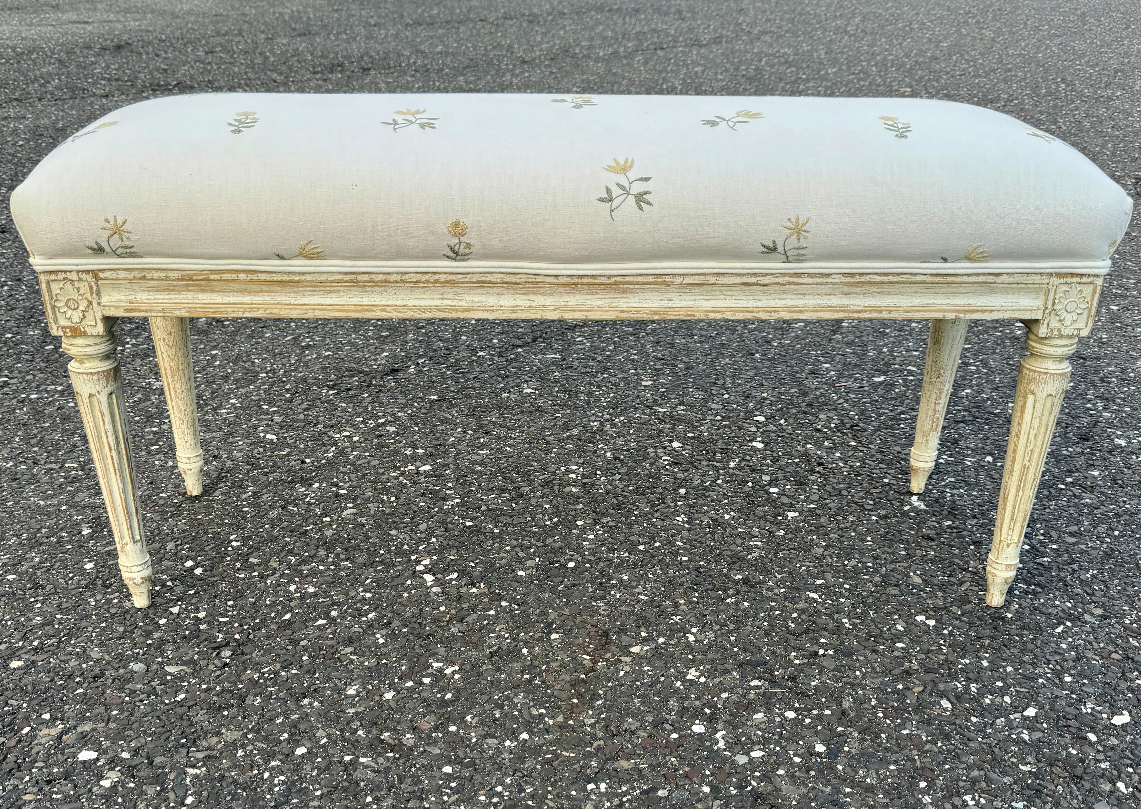 Swedish hand carved, solid wood and hand painted Gustavian bench upholstered in a floral silk blend fabric. Wonderful addition to any style home, used formally or informally in an entrance area, living room or bedroom. This bench is certainly a very