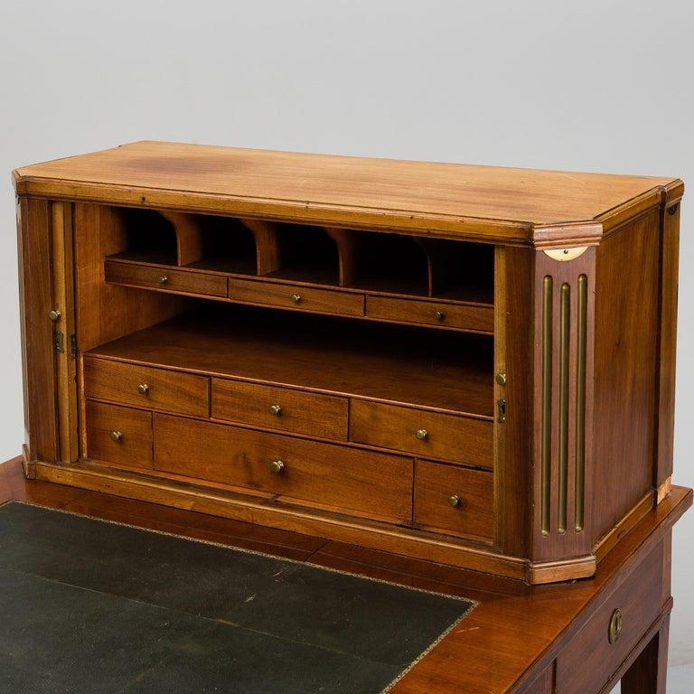 A Swedish late Gustavian writing desk, late 18th century in excellent antique condition. 
Key included.
Restored with additions. Slight damages, wear and repairs due to age and as shown in images.