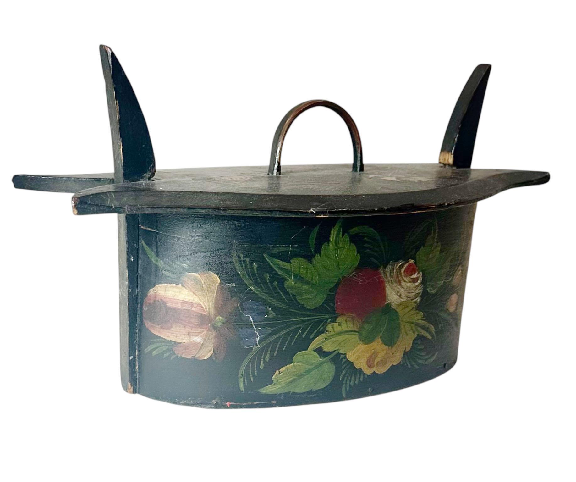 A charming Swedish bentwood box, circa 1890s, in very good condition. Entirely hand painted with floral motifs, this piece features a warm red painted interior and a decorative painted surface that continues all the way around. Traditionally, boxes