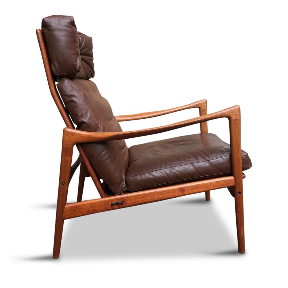 This lounge chair is incredibly comfortable, the seat cushions are surrounding you - they are really soft.

Teak wooden frame with original black rubber belts on metal clips, are removable and can be fixed in any position. Three leather cushions,