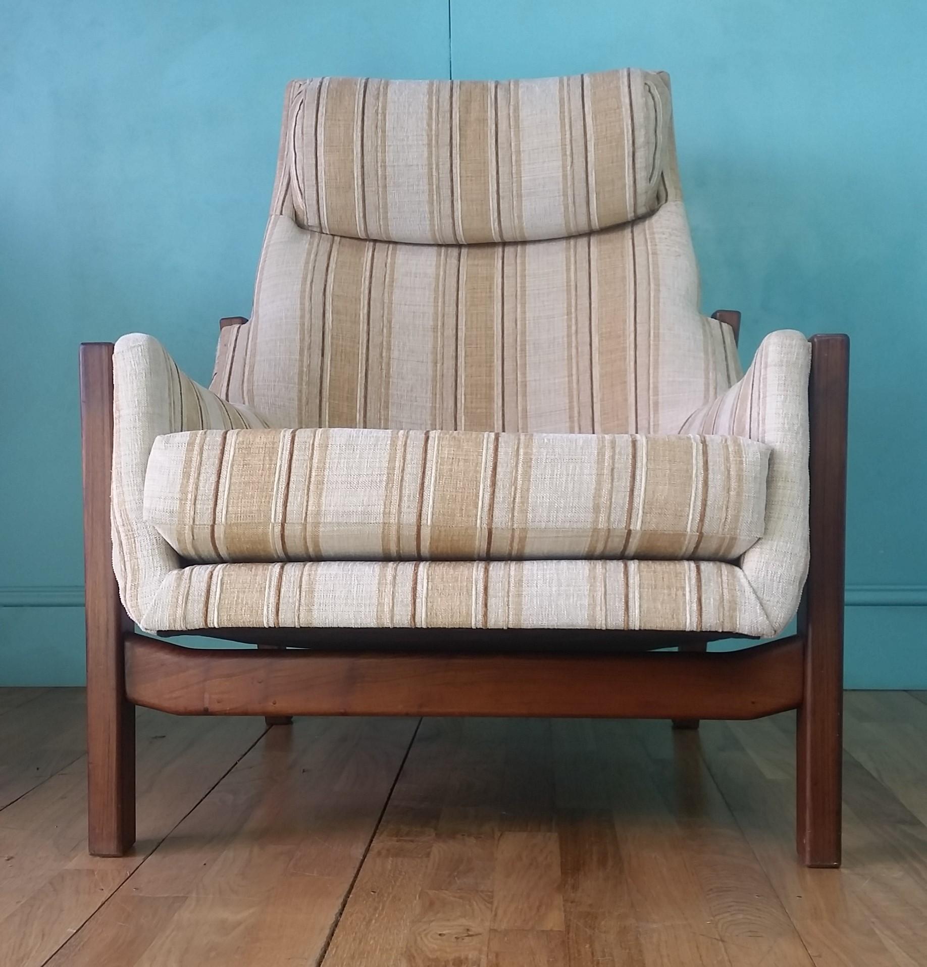 Swedish mid-century high back lounge chair circa 1960's.
Solid teak frame with original soft neutrally toned upholstery.
Angular design and stance to add some Scandinavian modern design to any interior.
The chair is in good condition for its age