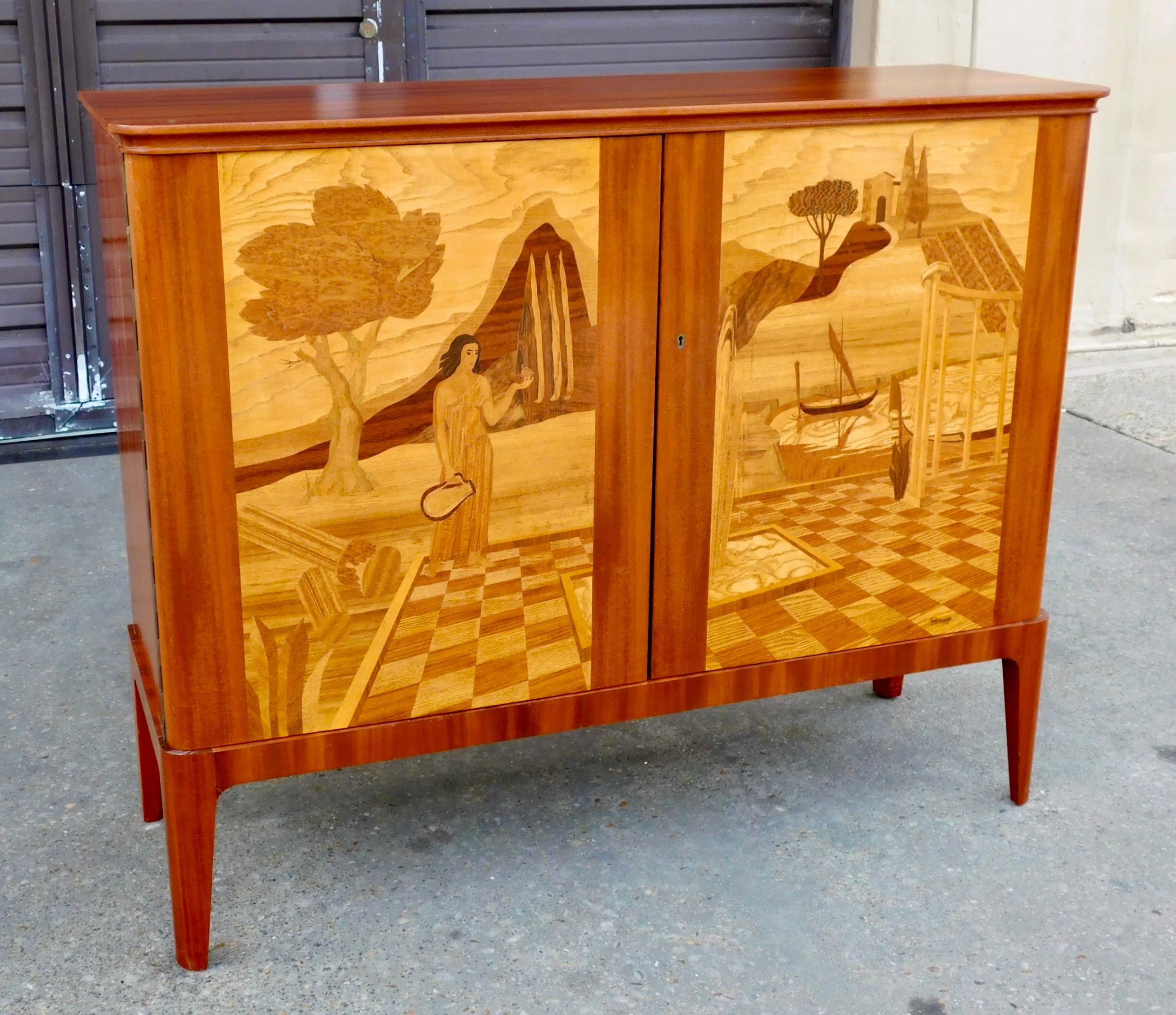 Exceptional Swedish moderne era storage cabinet by Erik Matsson (signed 1943) for Mjölby Intarsia.
Rendered in mahogany and birch wood. Inlaid friezes, depicting Mediterranean classical scenes, in rosewood, elm root and birch wood.
Interior in