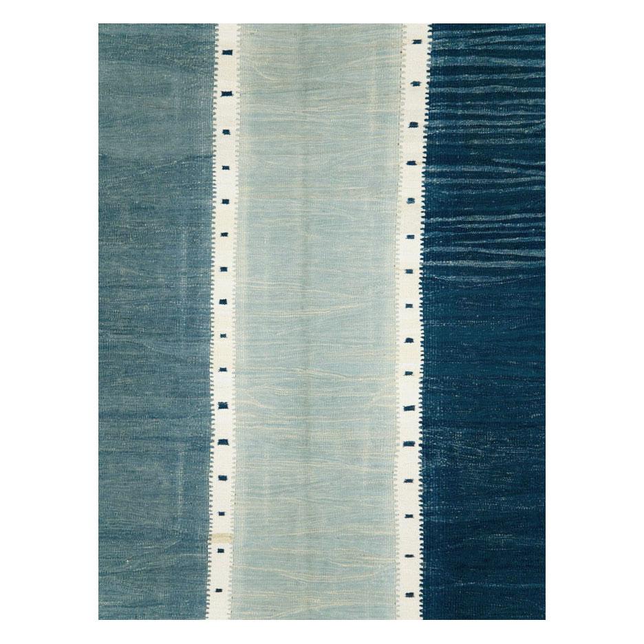 A modern Turkish flat-weave Kilim small room size carpet handmade during the 21st century. The weavers were inspired by Swedish/Scandinavian flat-weaves from the mid-20th century period.

Measures: 8' 3
