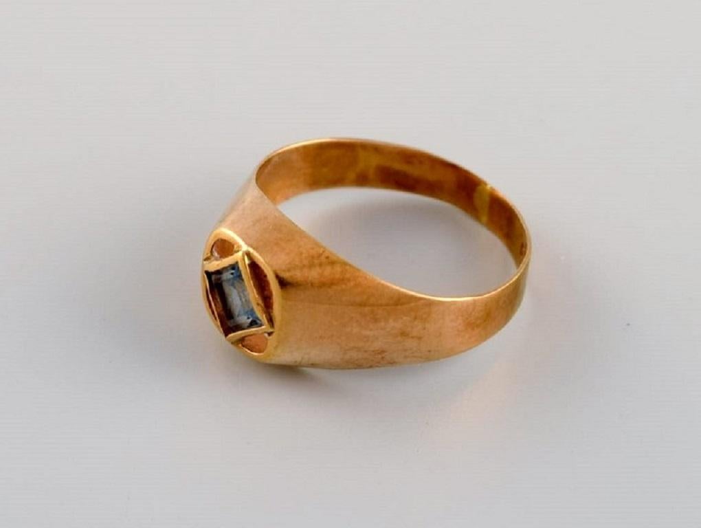 Swedish jeweler. Modernist vintage ring in 18 carat gold adorned with semi-precious stone. Dated 1967.
Diameter: 16 mm.
US size: 5.5.
In excellent condition.
Stamped.
In most cases, we can change the size for a fee (USD 50) per ring.