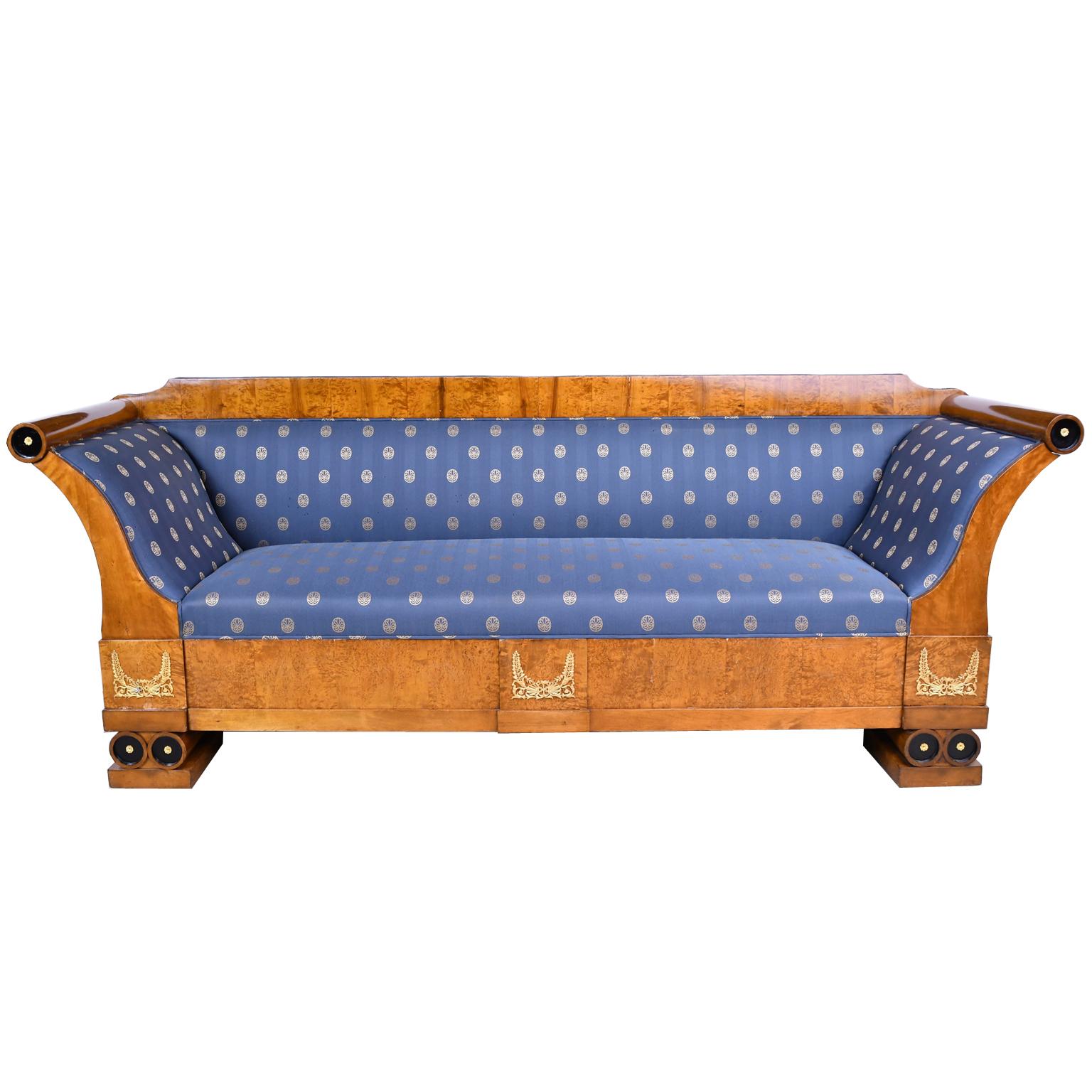 From the reign of French-born, Swedish emperor, Karl Johan (b. 1763-d. 1844), a handsome sofa in birch wood with ebonized details, and bronze d'ore ormolu mounts of rosettes, palmettes, ferns & acanthus. Sofa has scrolled arms and rests on base with