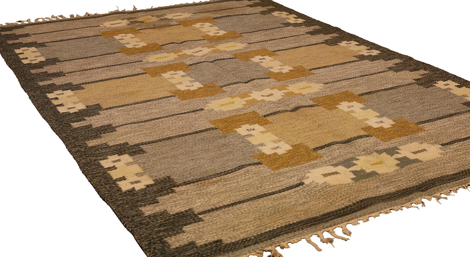 This vintage Swedish Kilim rug is an extraordinary piece of craftsmanship. Woven circa 1920-1950, it features a beautiful all-over geometric design and the GS signature. The production style of this piece is handmade loom woven, which makes it a
