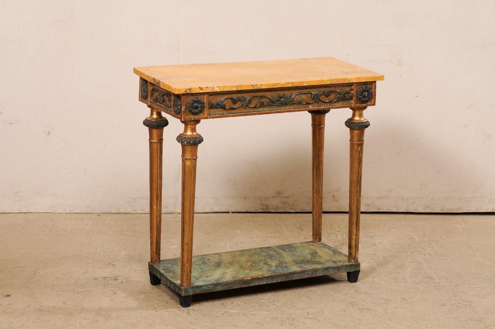 A Swedish late Gustavian petite console table, with stunning marble top and secondary platform shelf, from the late 18th to early 19th century. This smaller-sized antique table from Sweden has a particularly beautiful marble top, rectangular in