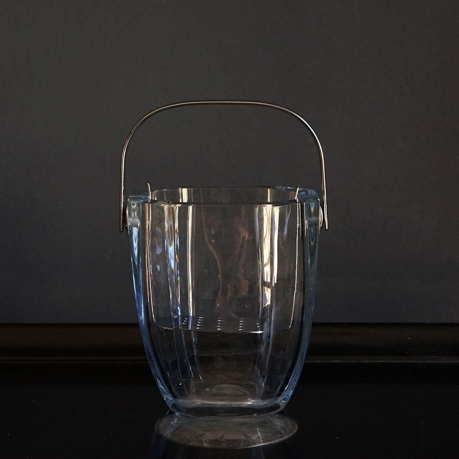 VINTAGE SWEDISH LEAD CRYSTAL ICE BUCKET BY GERDA STRÖMBERG FOR STROMBERGSHYTTAN, 1960S

Heavy gauge faceted lead crystal.

Ingenious stainless steel draining platform to allow meltwater to collect at the bottom.

Hand signed on the base ‘Stromberg