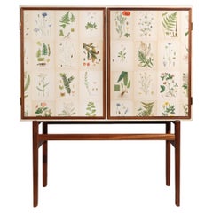 Swedish Mahogany Cabinet with Norden's Flora Illustrations, after Josef Frank