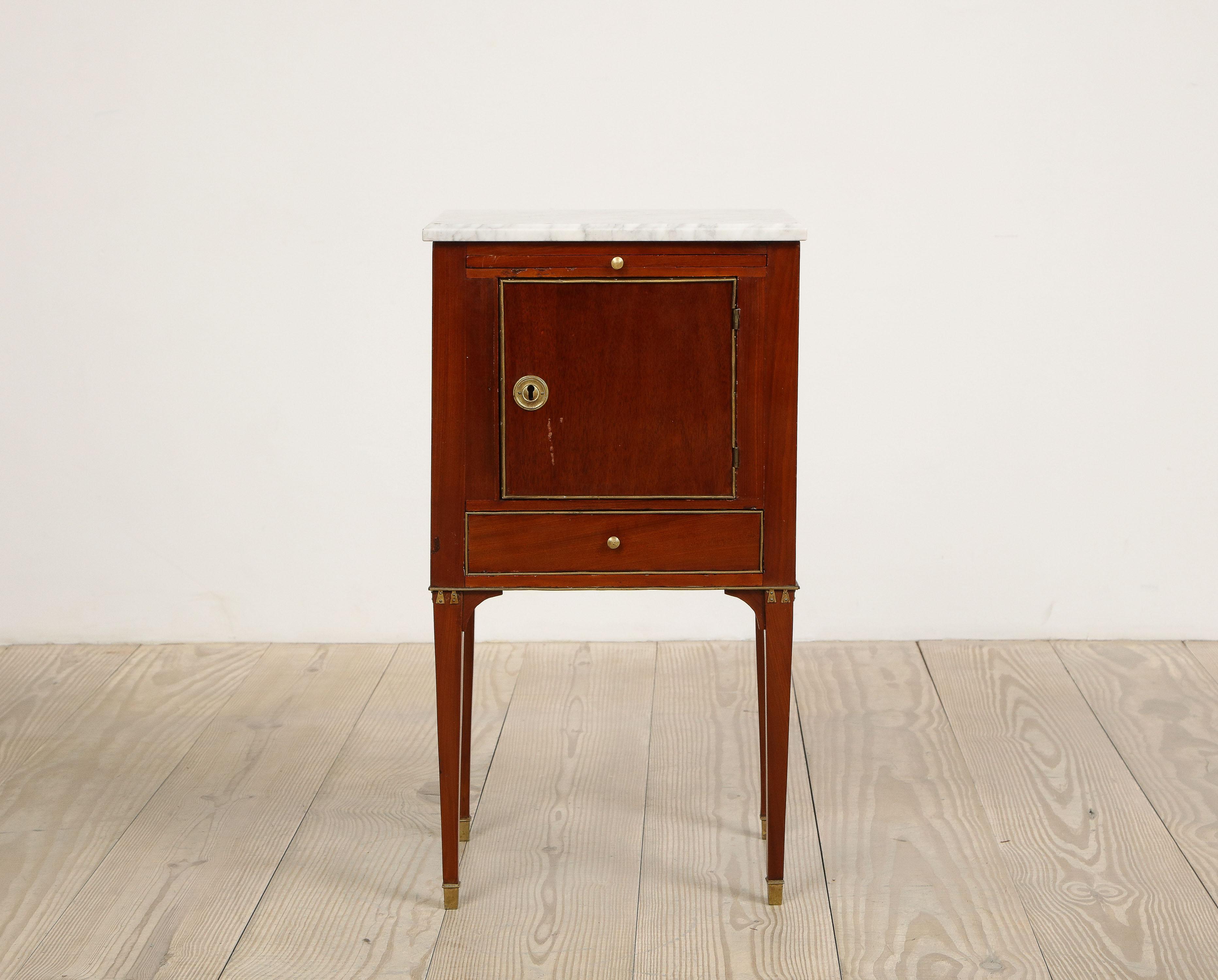 Beautiful Swedish mahogany Gustavian-style side table - cabinet with original marble top, circa 1850, origin: Sweden 

Pullout candle rest /writing surface, single door above single drawer with brass beaded fronts and beaded skirt. Square tapered