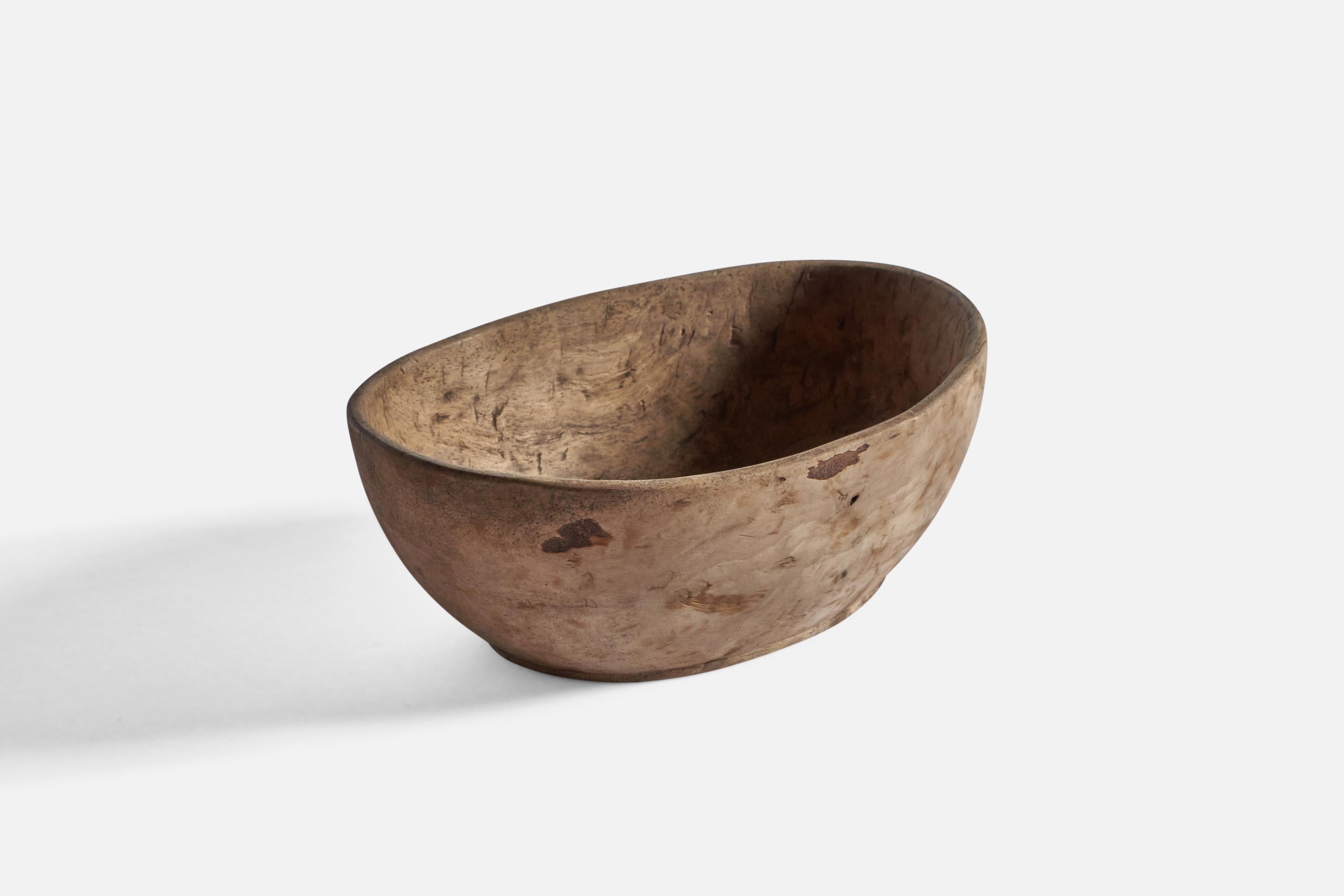 An antique solid wood bowl, produced in Sweden in the 19th century.