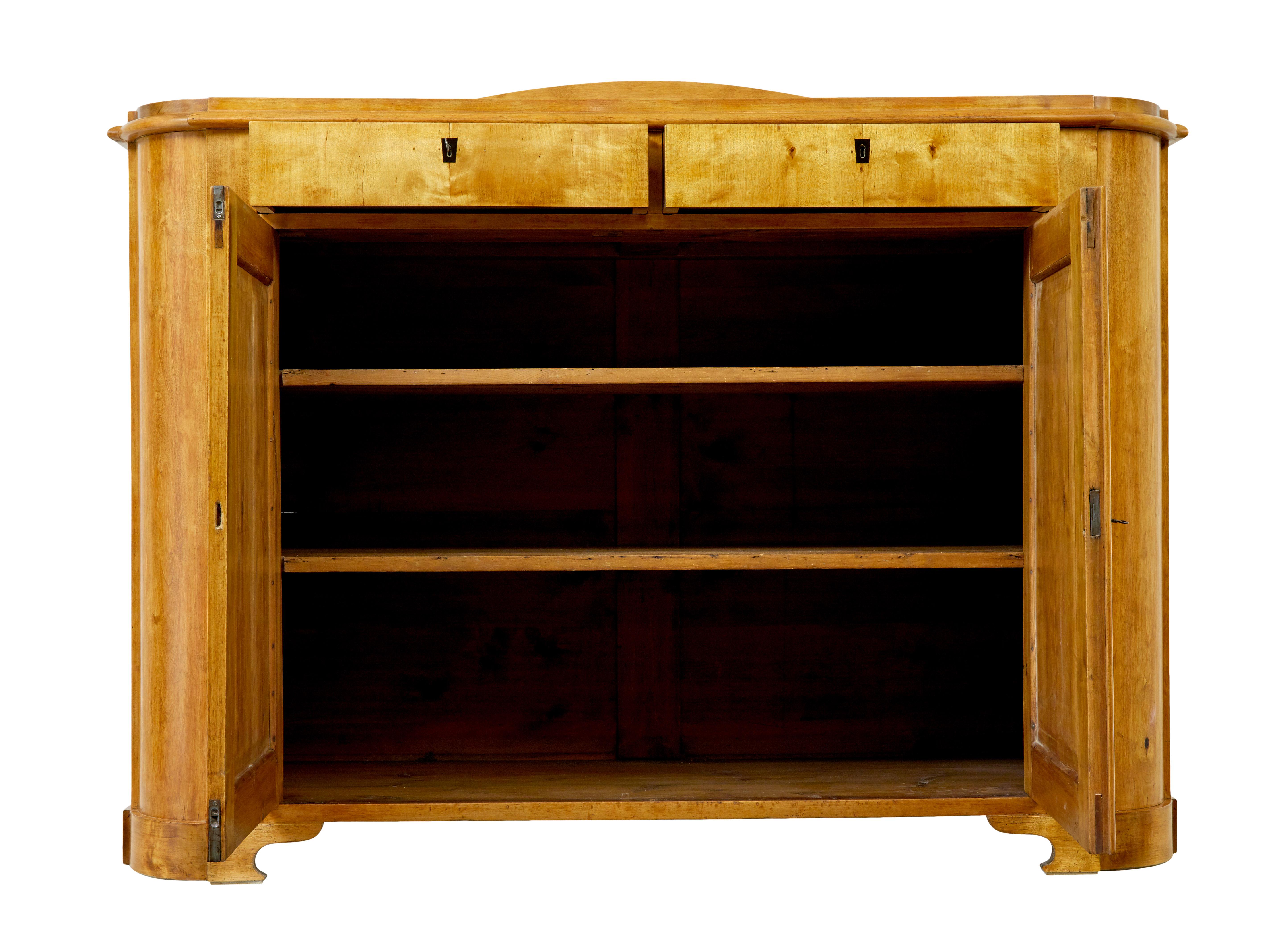 Swedish mid 19th century birch buffet sideboard circa 1860.

Fine quality Swedish buffet of grand proportions.  Top surface with shallow gallery on the back. 2 lockable drawers below the top surface with ebonised key plates.  Below which a double