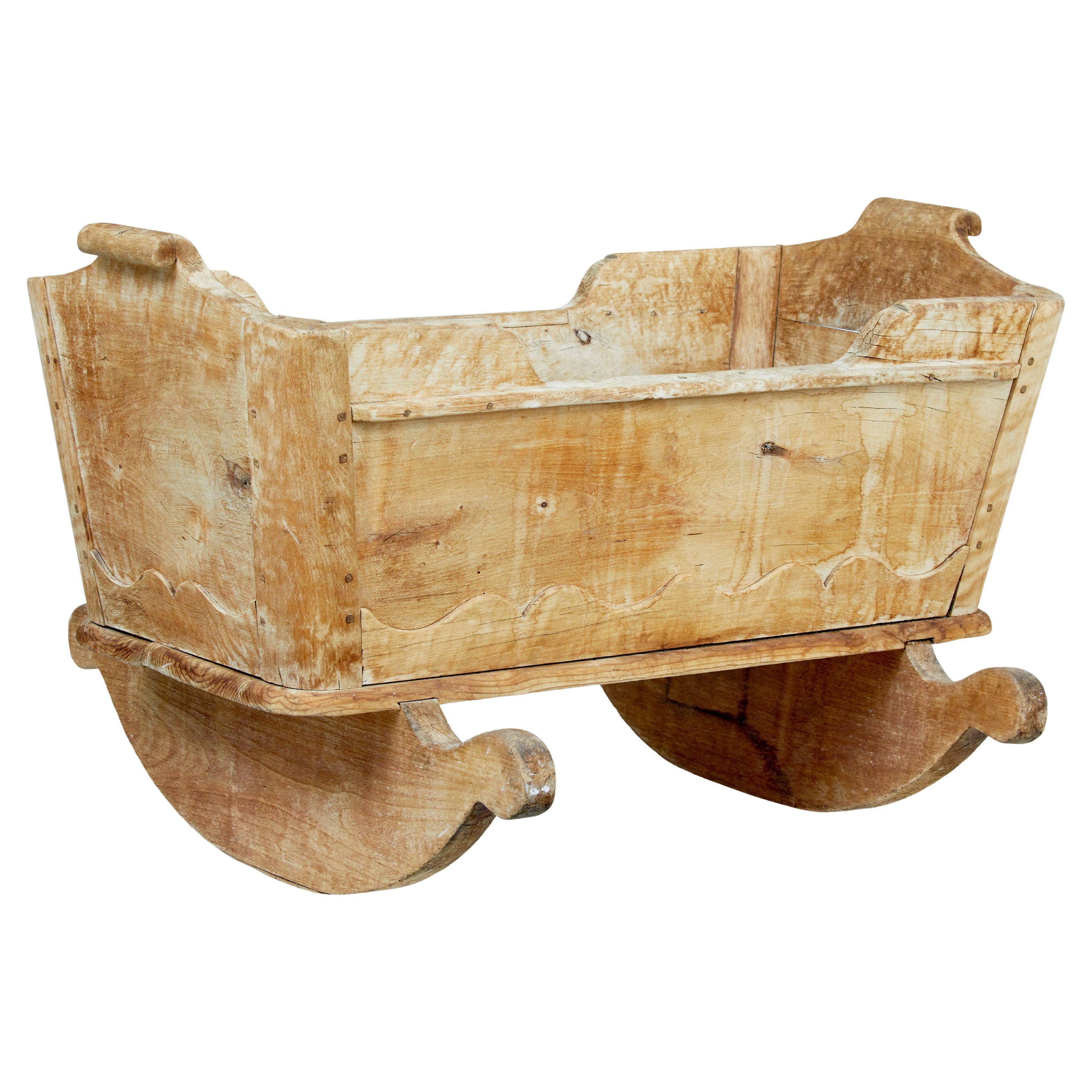 Swedish mid 19th century carved pine rocking cradle