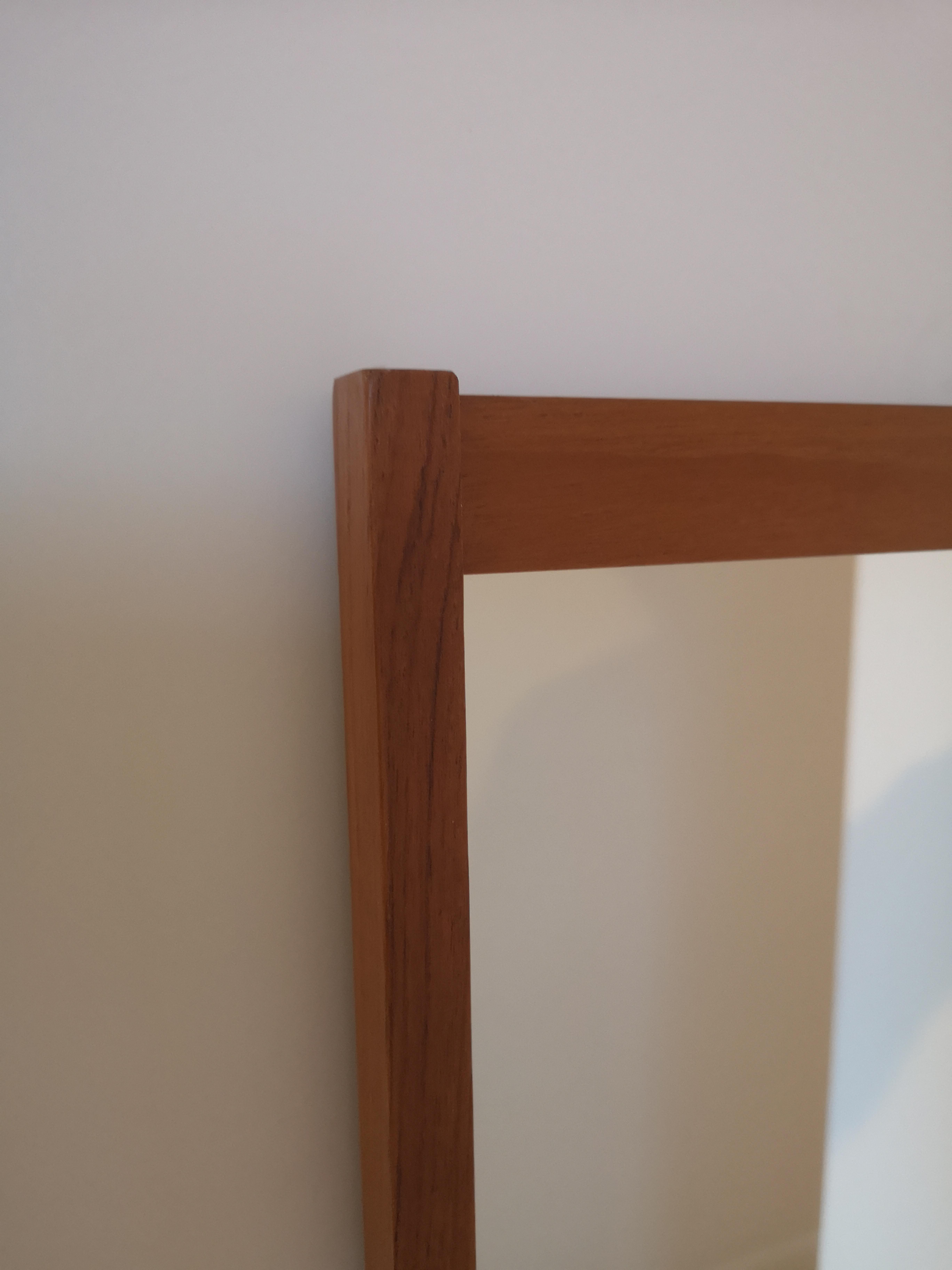 A beatifully crafted Swedish teak mirror from 1960s. This mirror is model 