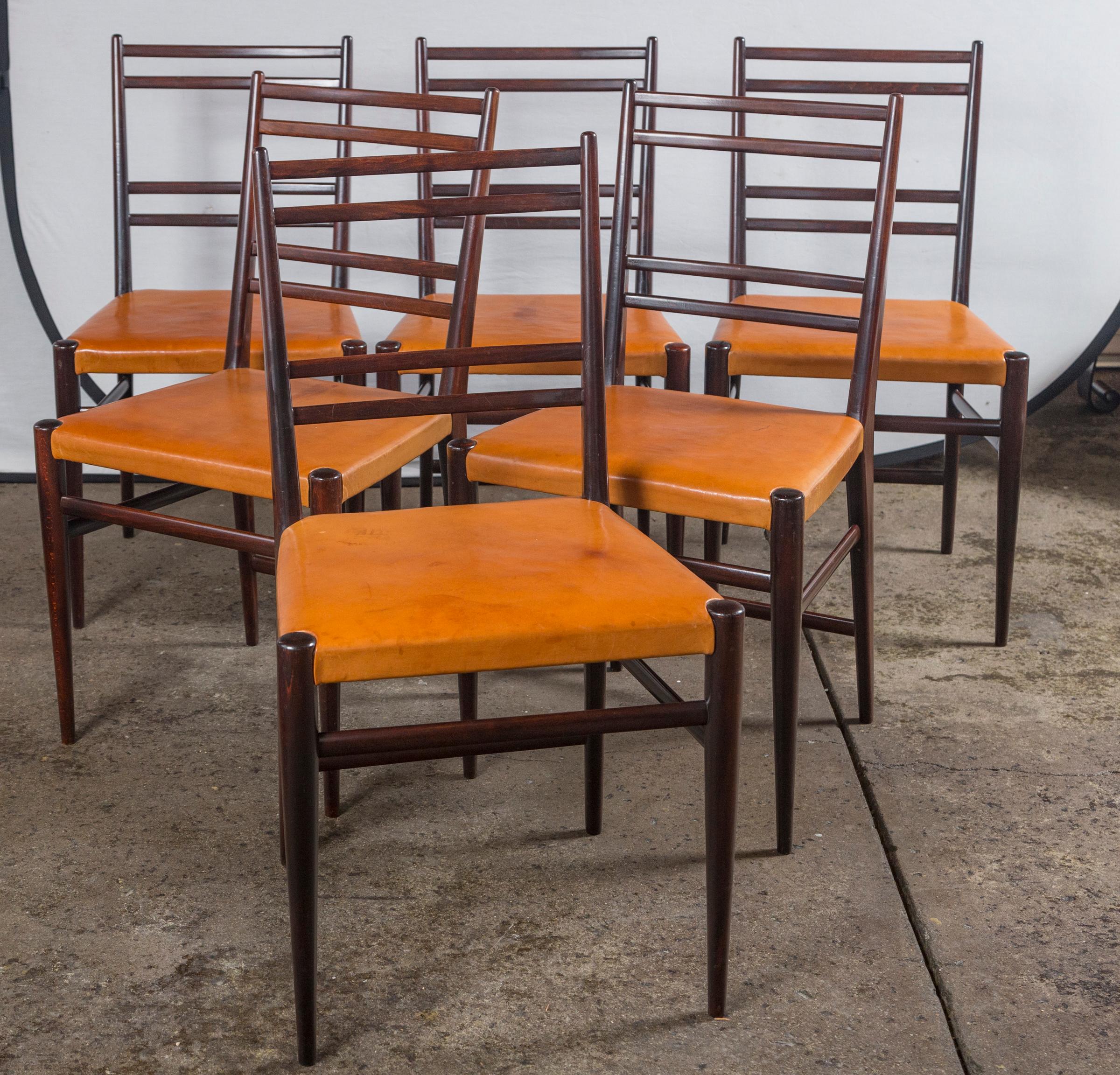 Swedish mid-century brown leather and wood dining chairs, set of 6.